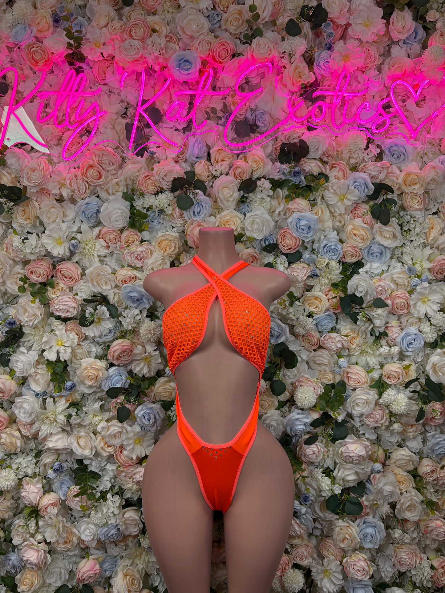 Orange halter one-piece bodysuit with open back and strappy underbust cutouts