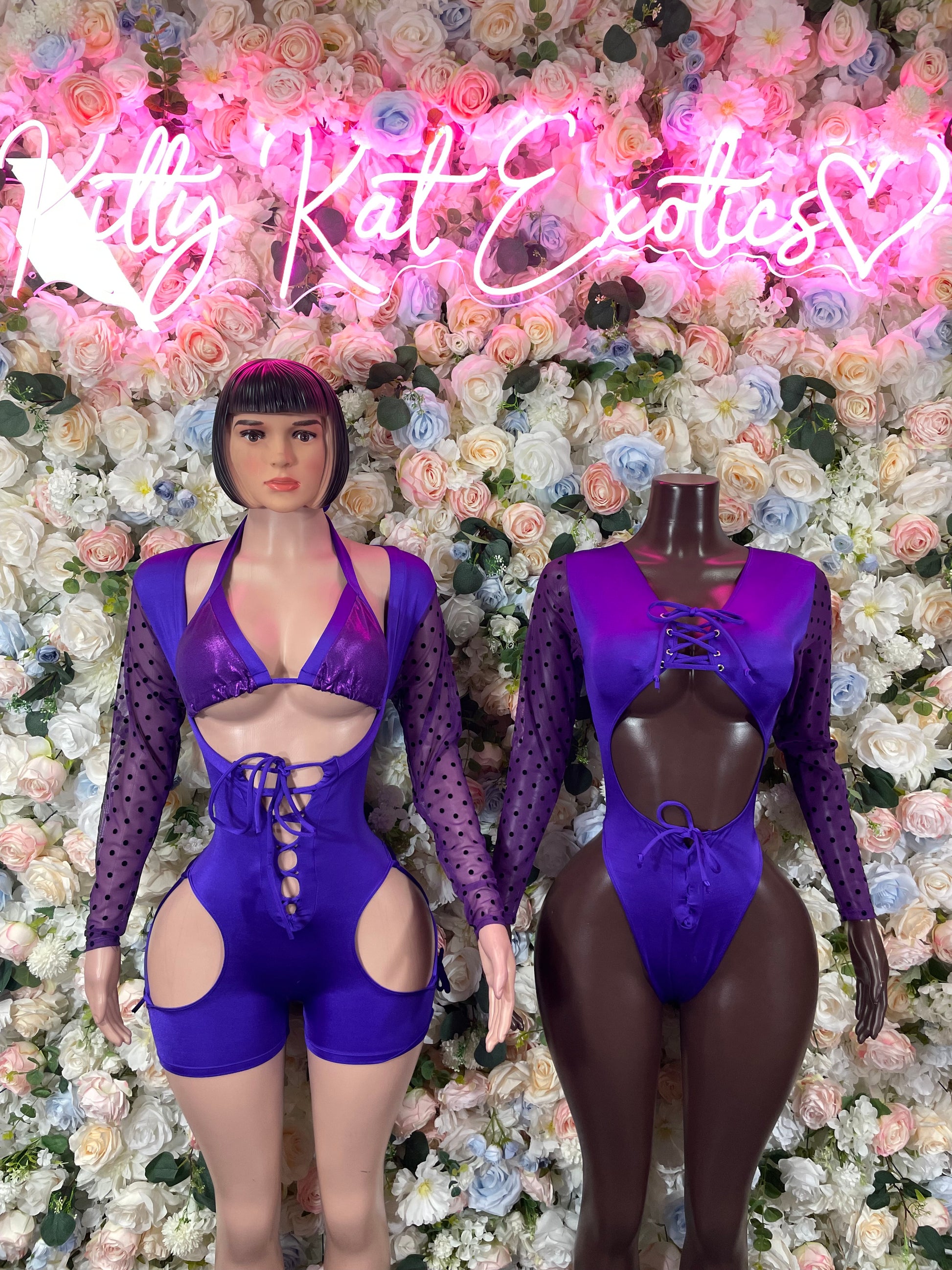 Purple long-sleeve bodysuit on two mannequins, V front and lace-up detail