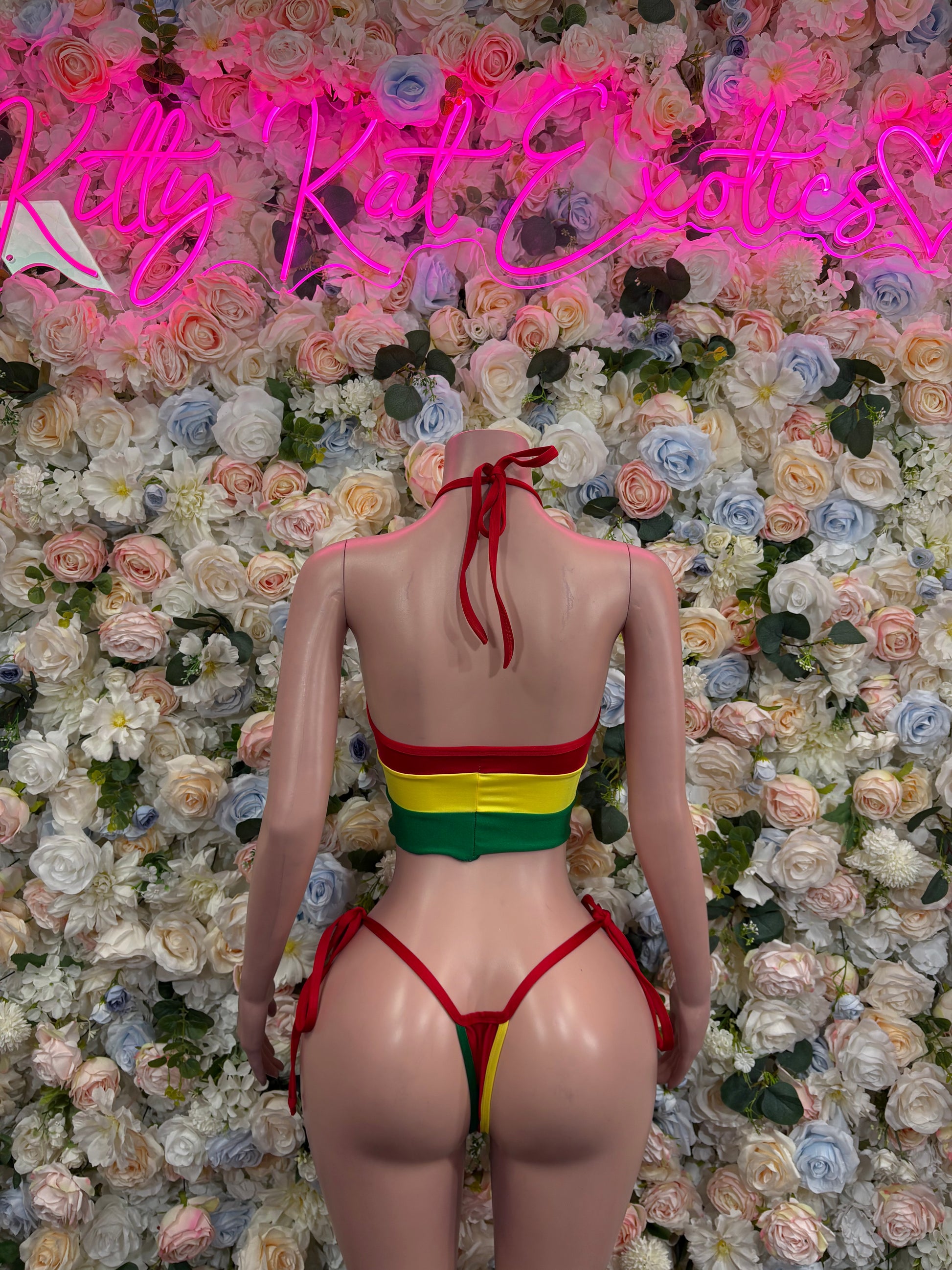 Red two-piece bikini swimsuit with yellow-green stripe; halter top and tie-back bottoms