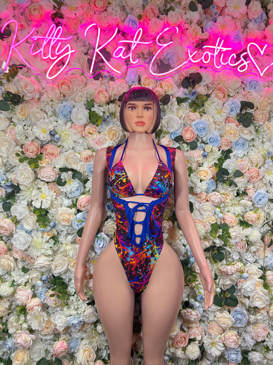 Multicolor paint-splatter one-piece with V neckline and lace-up front cutout