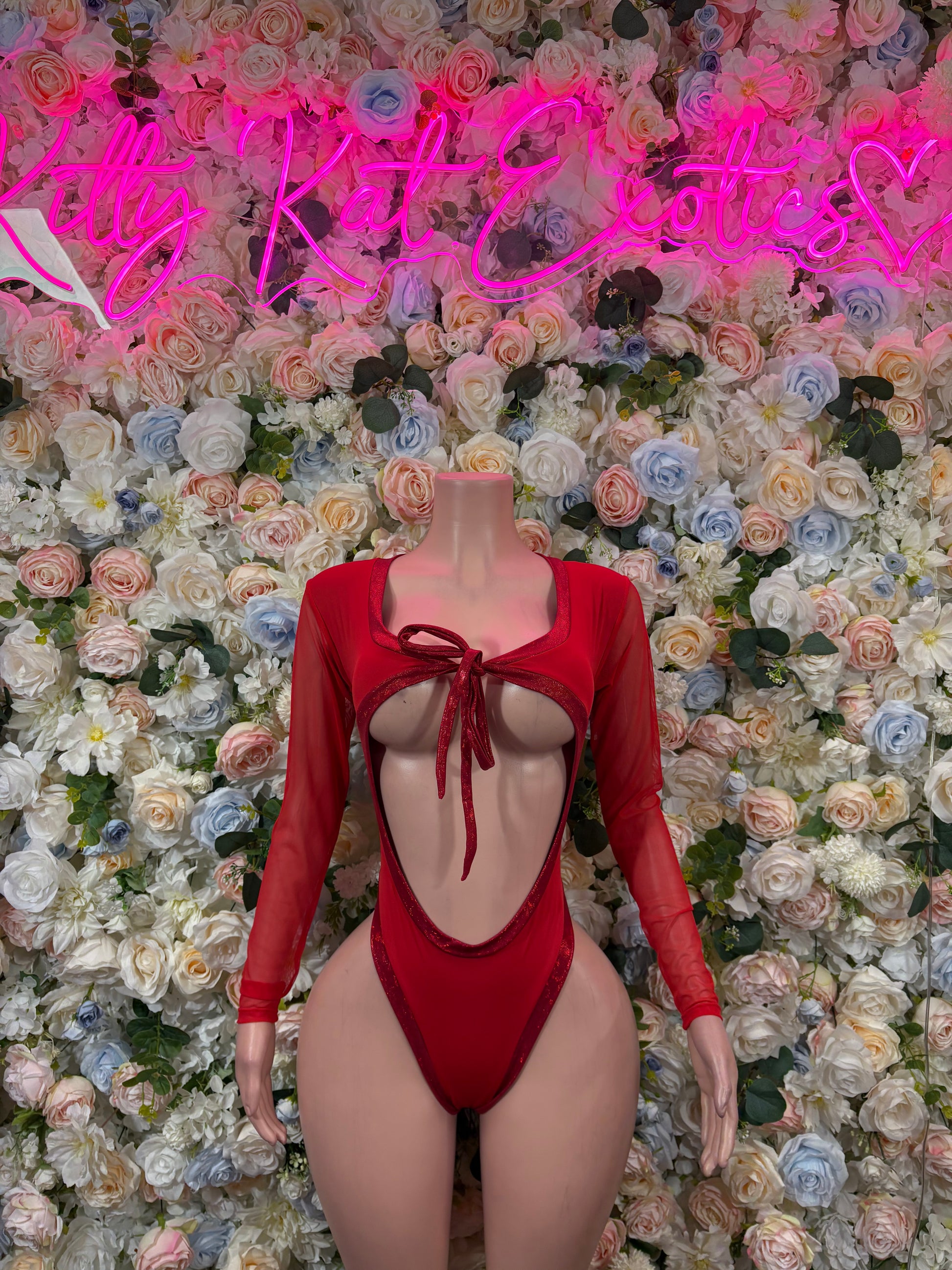 Red lace-up heart bodysuit with long sleeves and open back