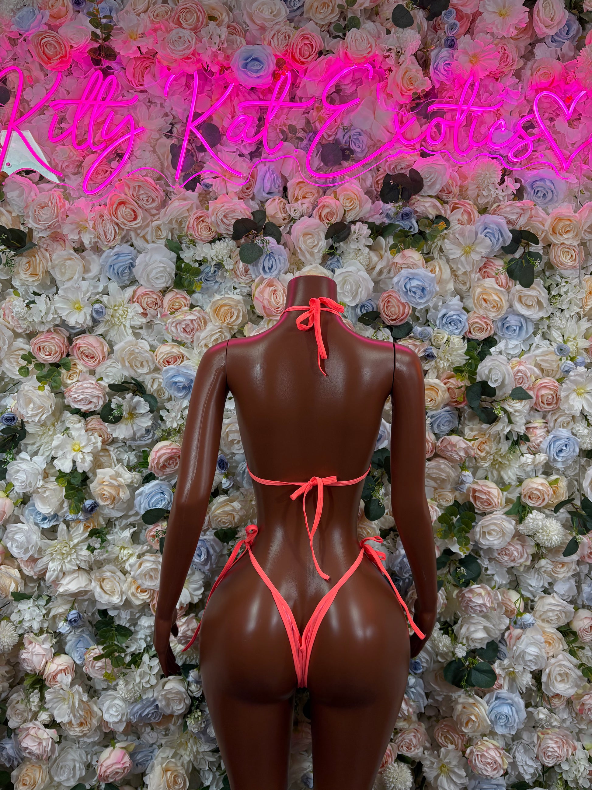 Coral metallic one-piece bodysuit with tie-back straps and low back