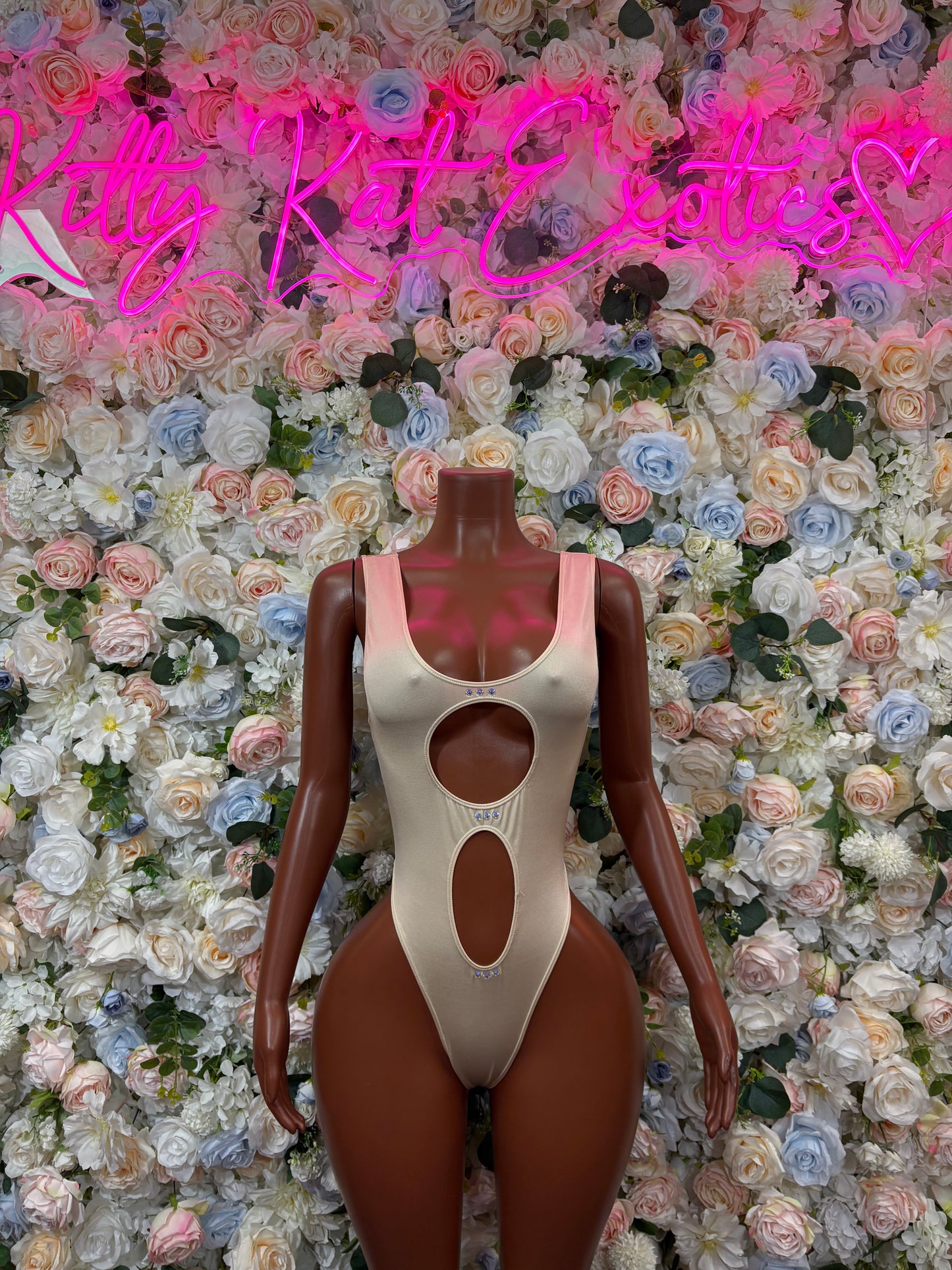 Cream nude bodysuit with scoop neckline and oval cutouts, one-piece