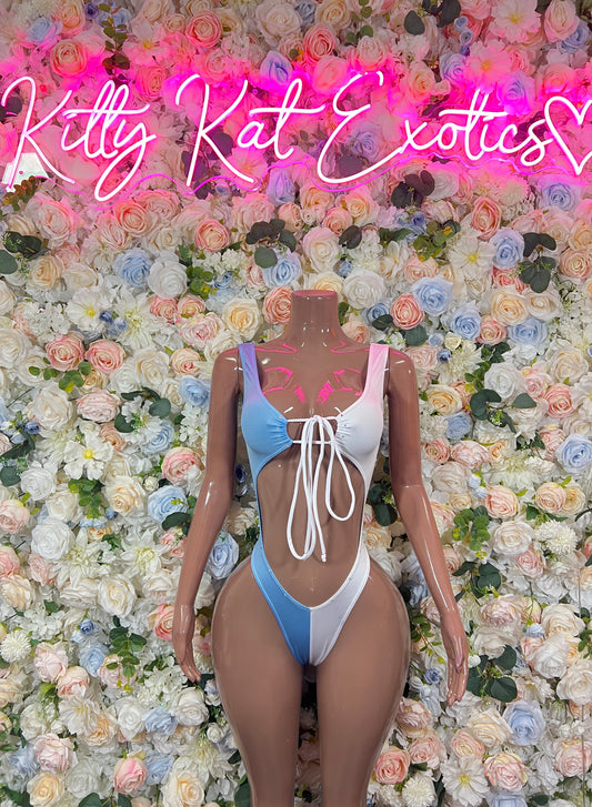 One-piece swimsuit with light blue sides, white center stripe, and lace-up front