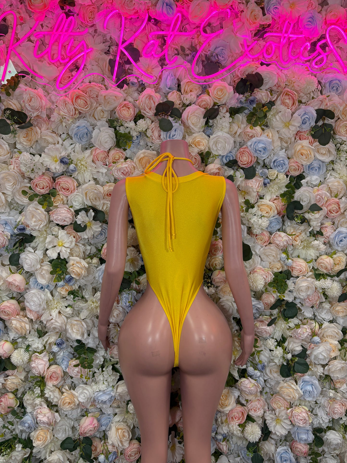 Yellow metallic backless bodysuit with tie at back neck and V-back cutout