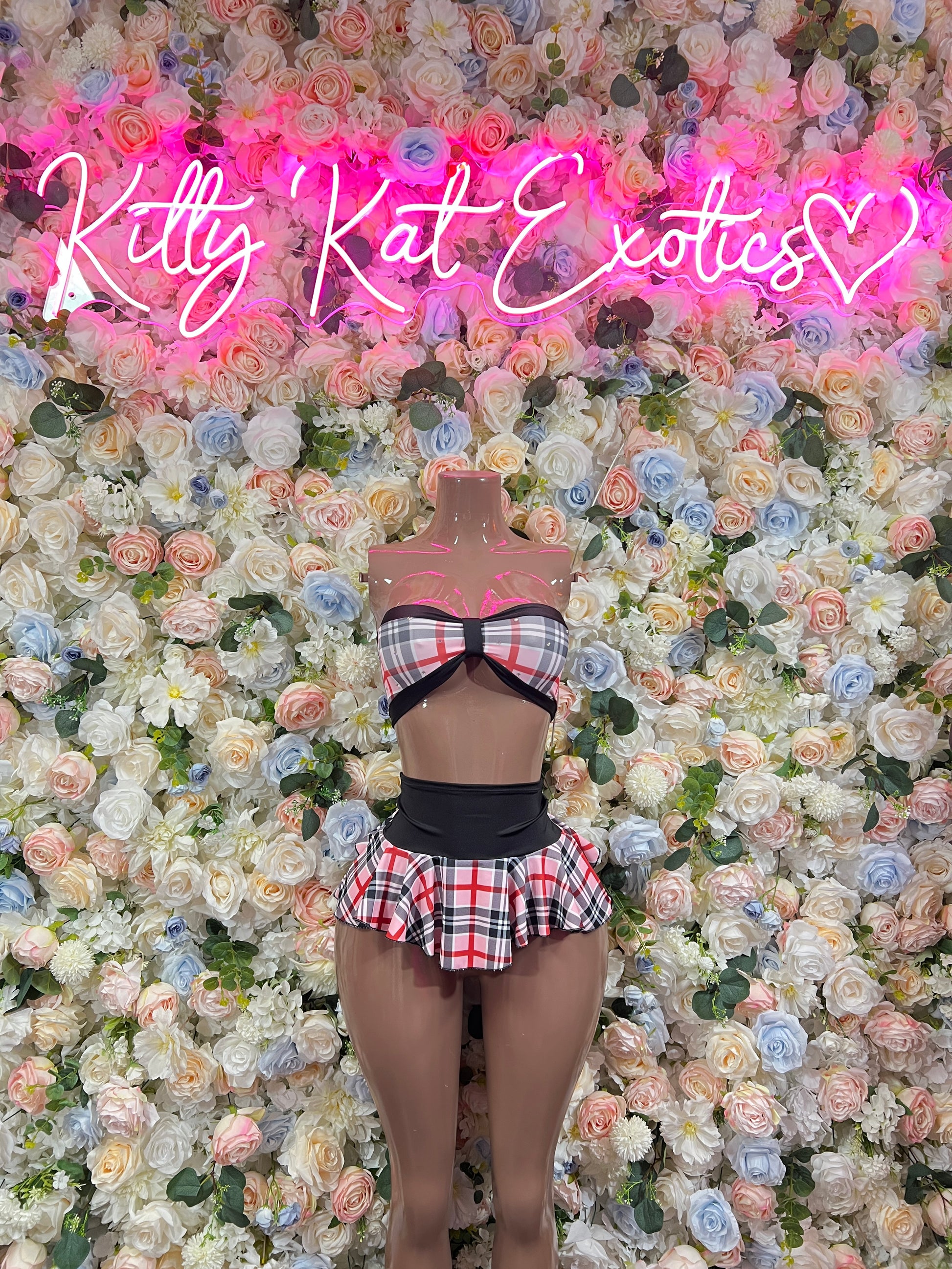 Pink plaid two-piece skirt set with bow halter top and black waistband (mannequin)