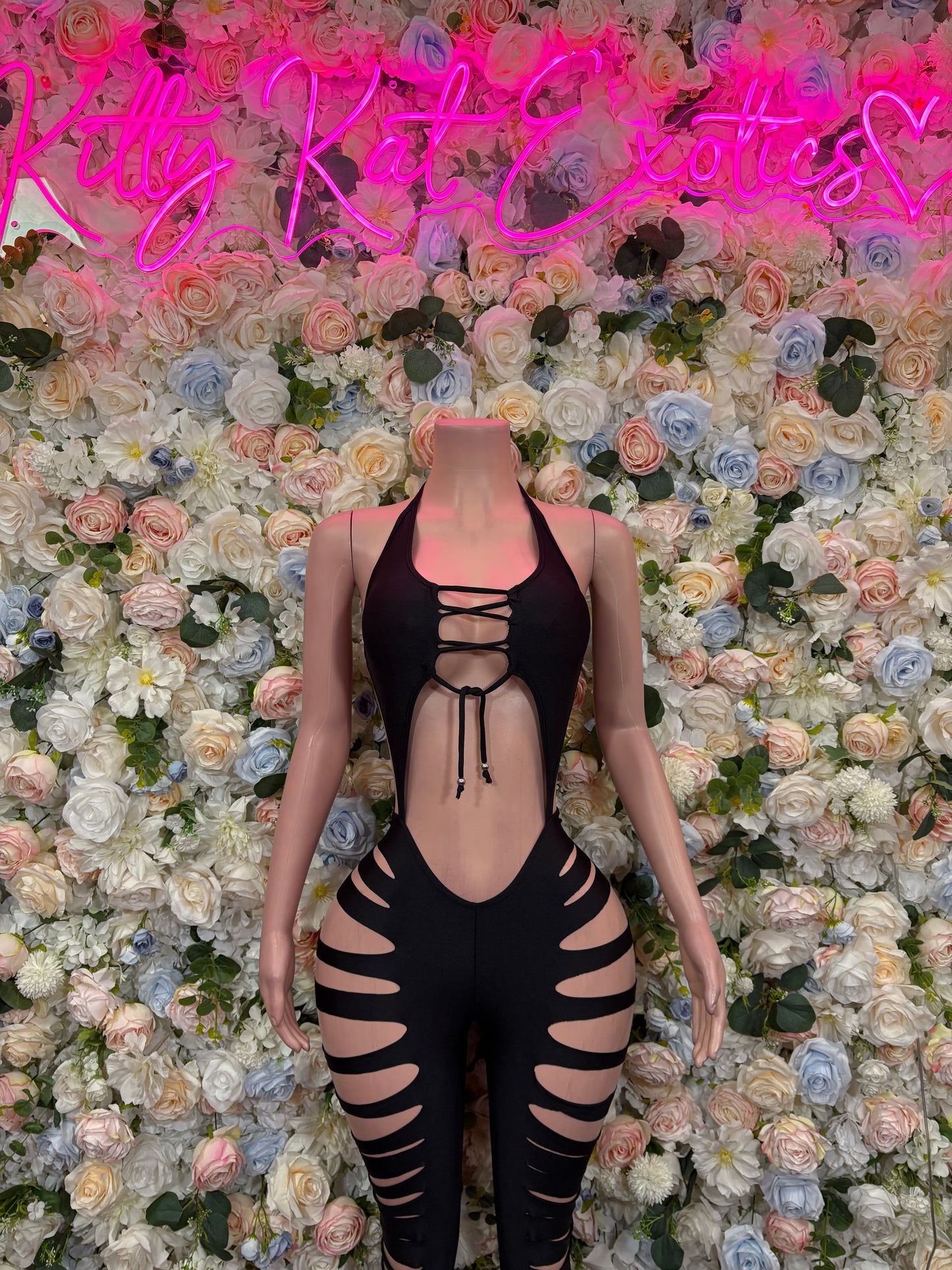 Black lace cutout bodysuit with strappy back and ribbon ties