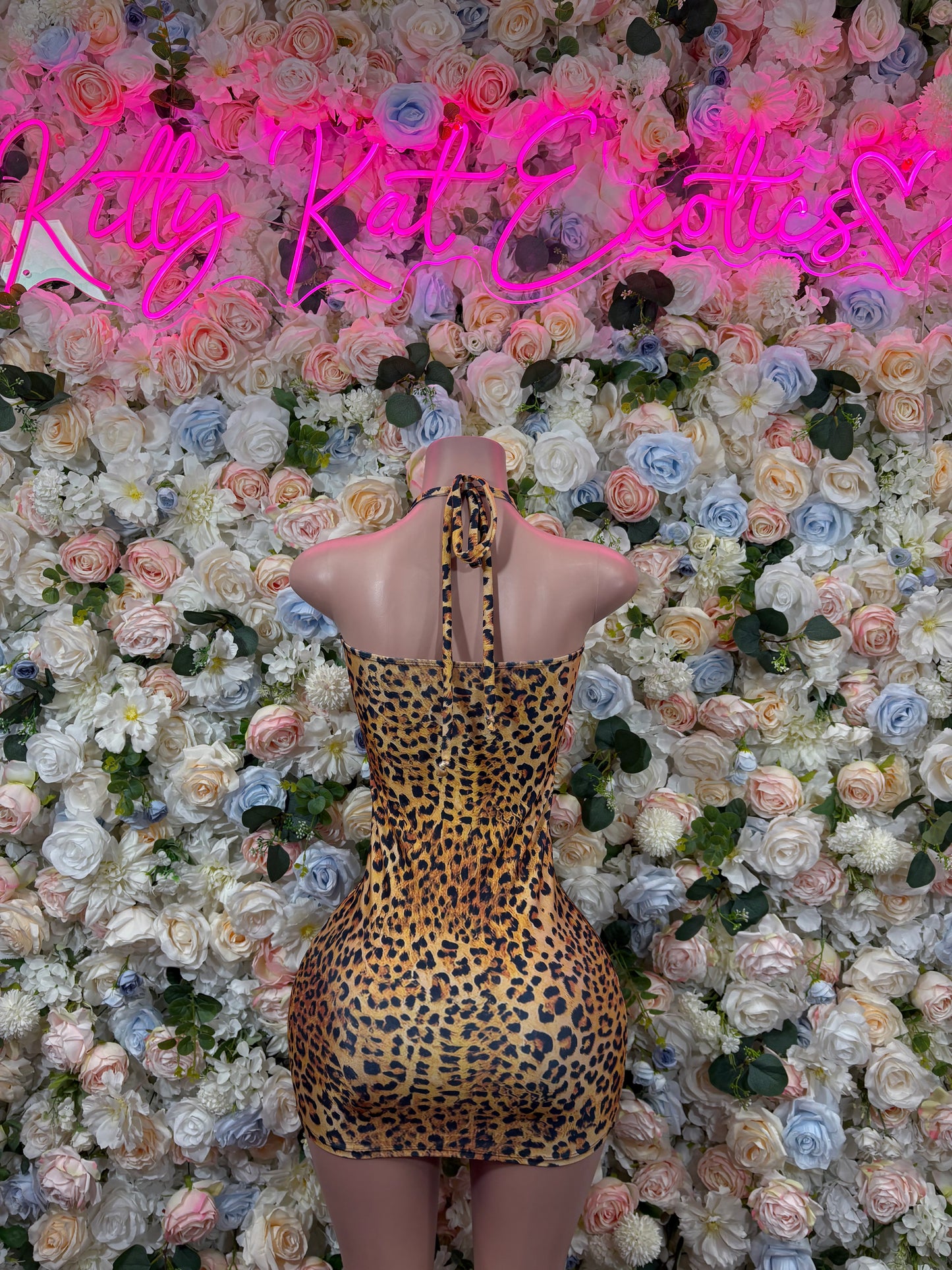Leopard print mini dress with halter straps and open back