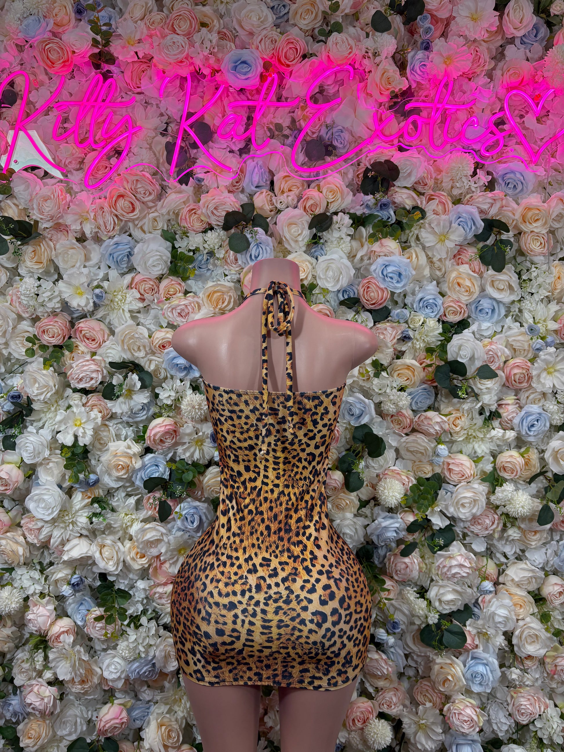 Leopard print mini dress with halter straps and open back