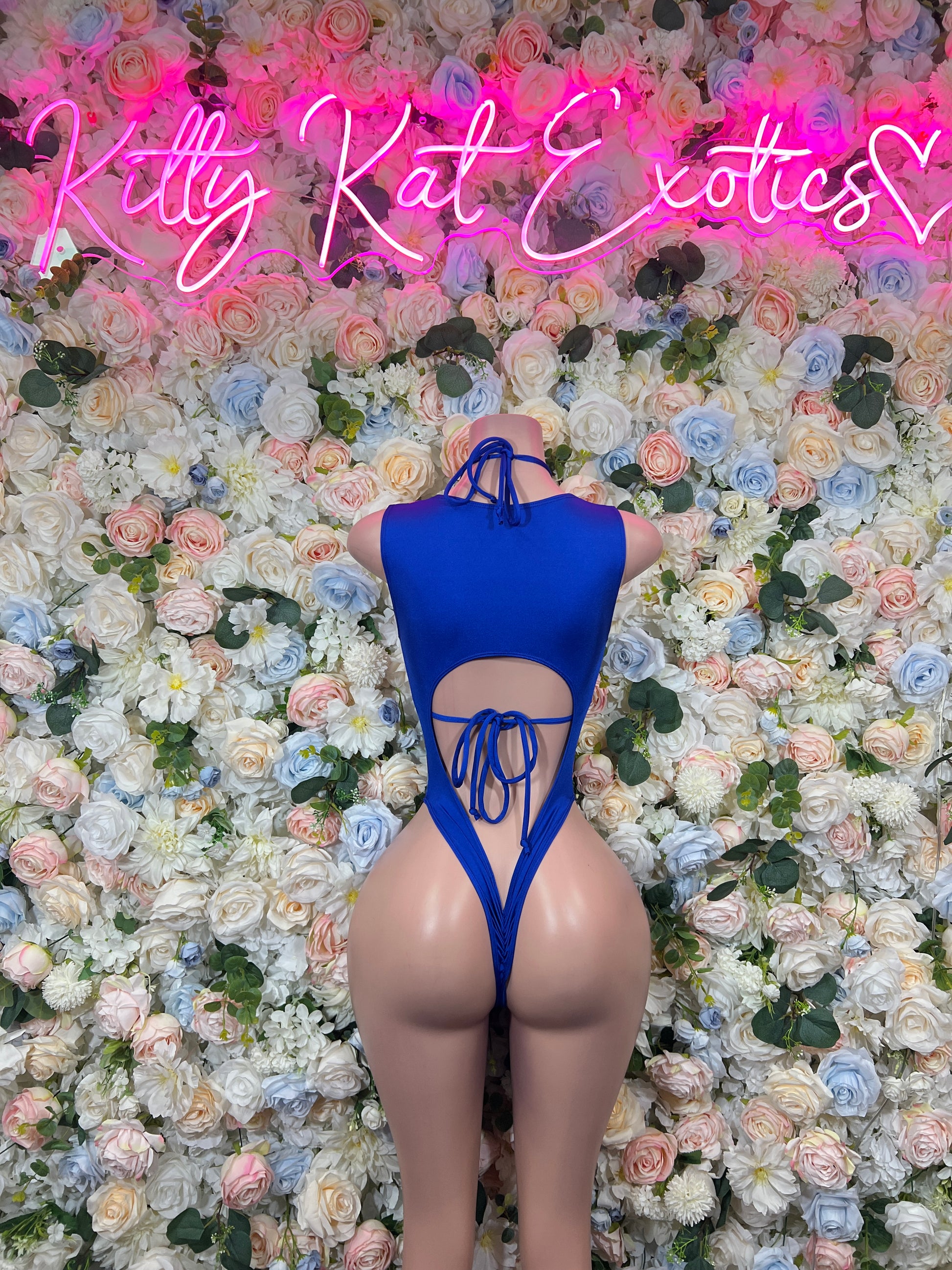 Back-view blue paint-splatter bodysuit with lace-up halter straps and open back