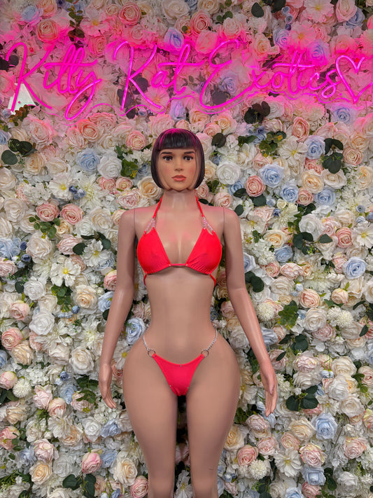 Coral two-piece rave bikini set with triangle halter top and matching hipster bottoms