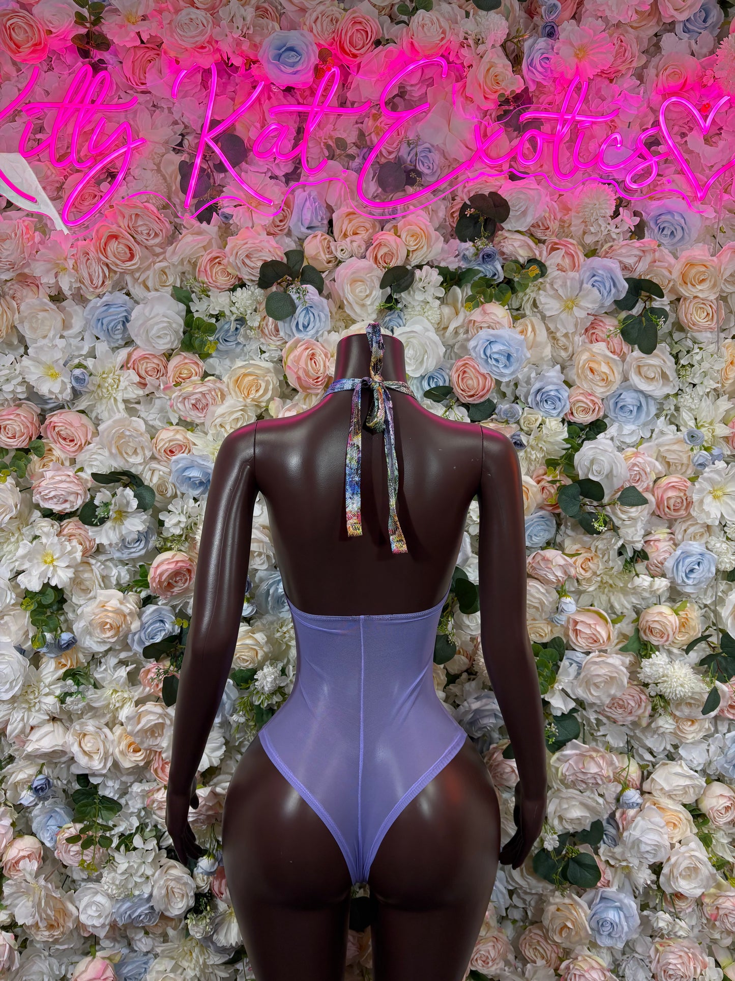 Purple halter bodysuit with open back and vertical back detail
