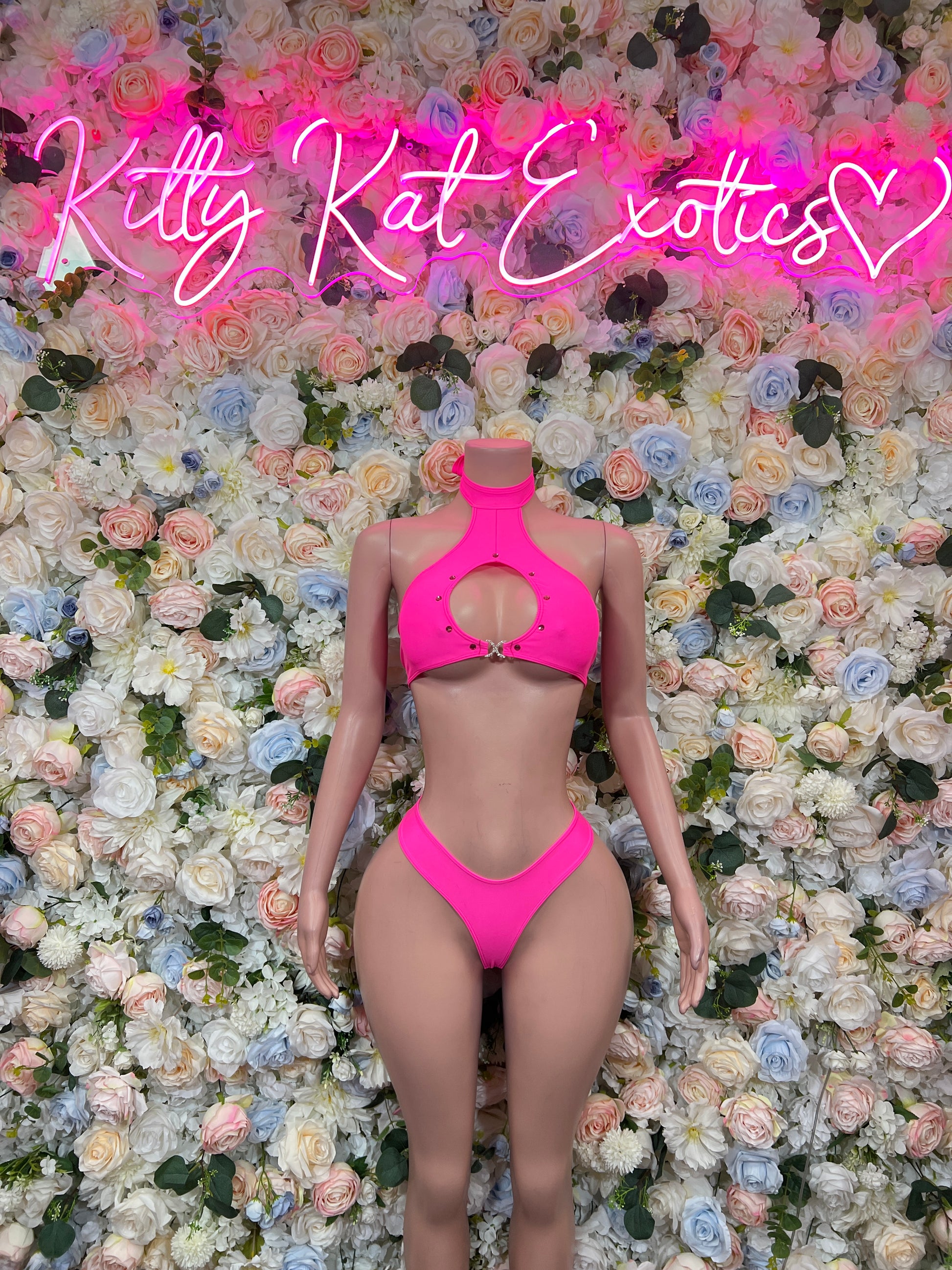 Pink halter two-piece bikini with front cutout and high-cut bottoms, front view