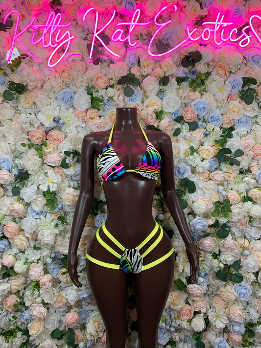 Multicolor bikini two-piece with rainbow triangle top, neon yellow-green trim, striped bottoms