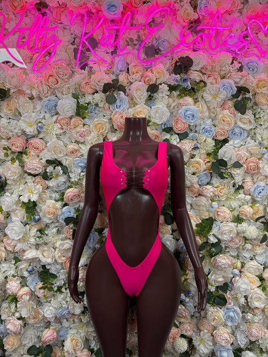 Pink sleeveless thong bodysuit with deep V neckline and high-cut leg