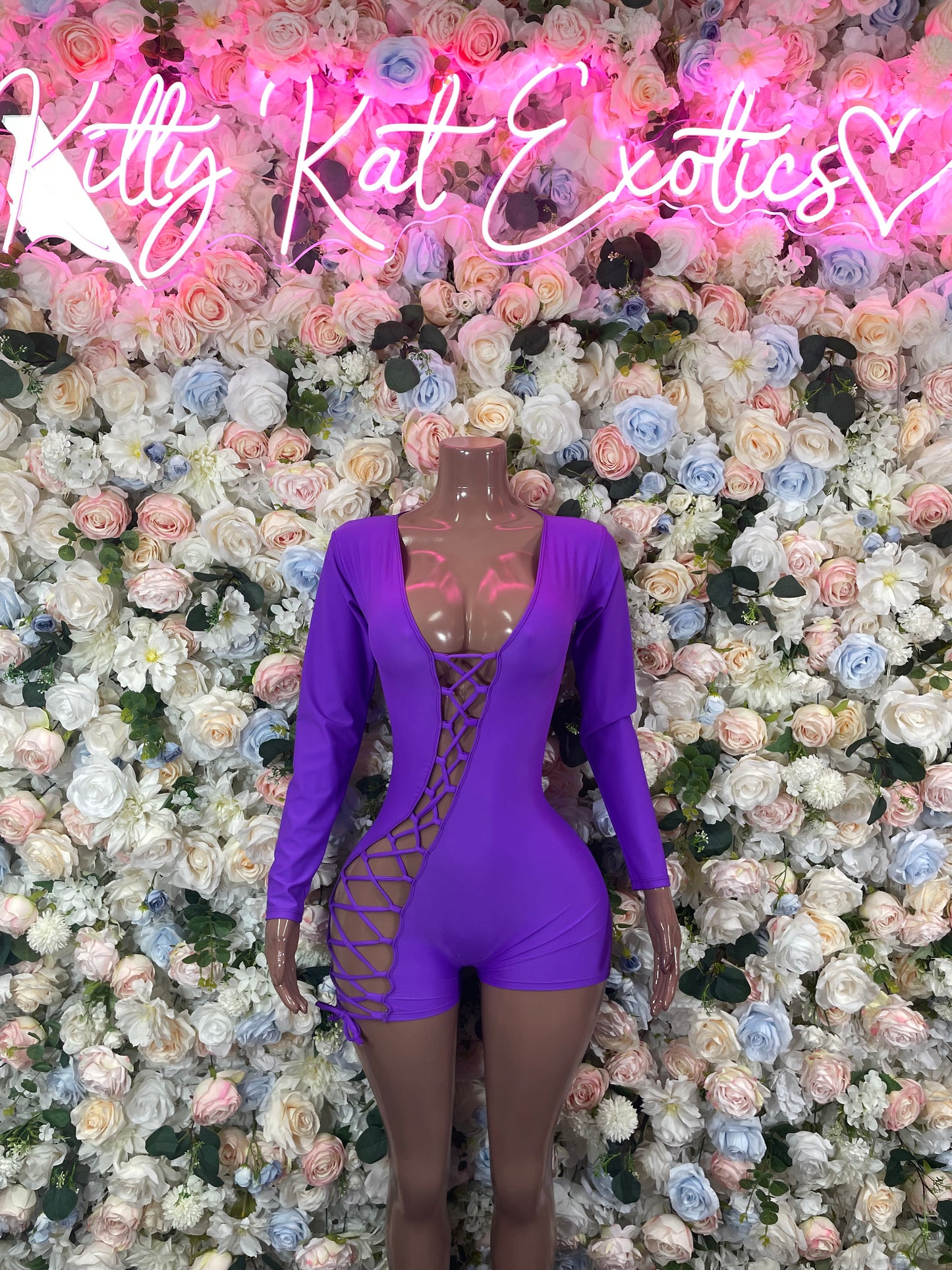 Purple long-sleeve lace-up one-piece bodysuit with V-neck cutouts
