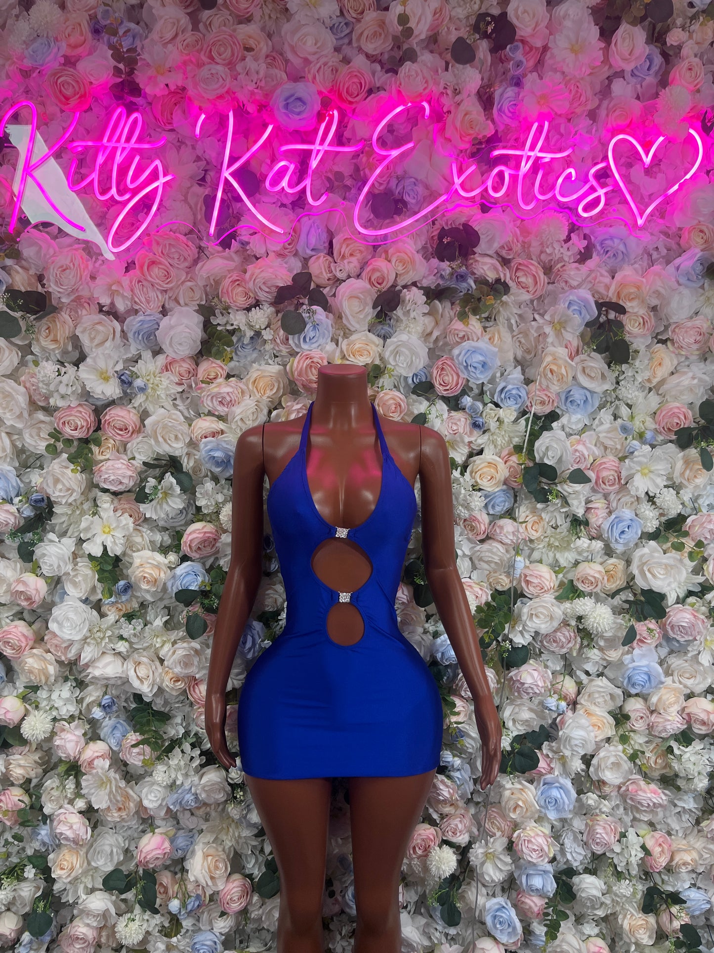 Royal blue mini dress with halter straps, plunging neckline, and oval waist cutout