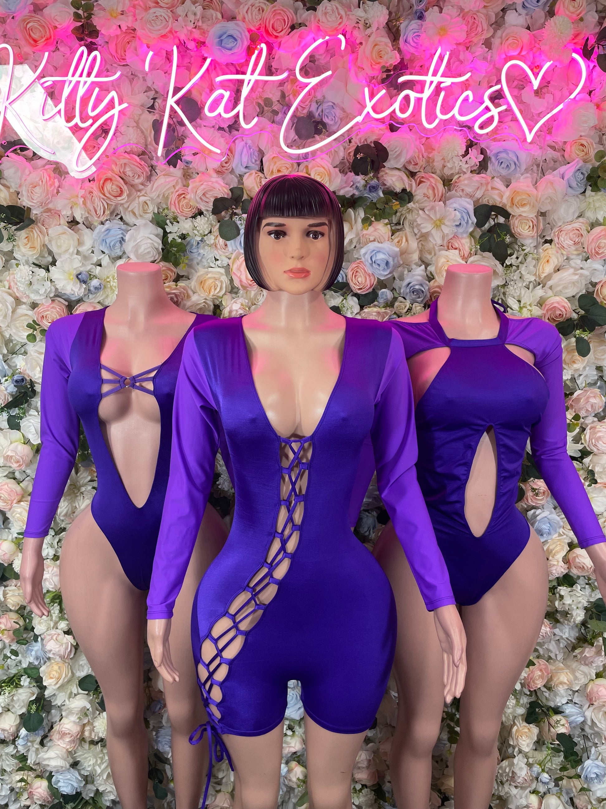 Purple long-sleeve bodysuits with lace-up front and V-neck