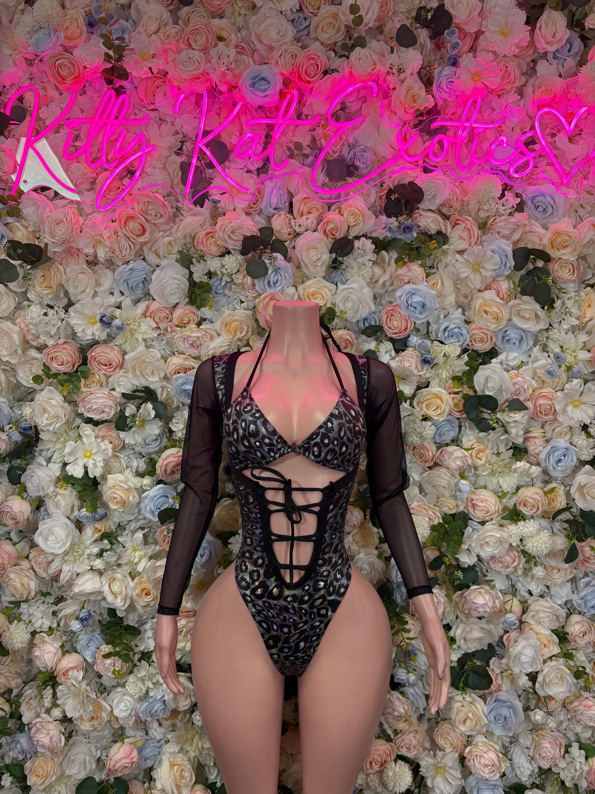Black lace-up bodysuit with deep V neckline, cross-front, long sheer sleeves