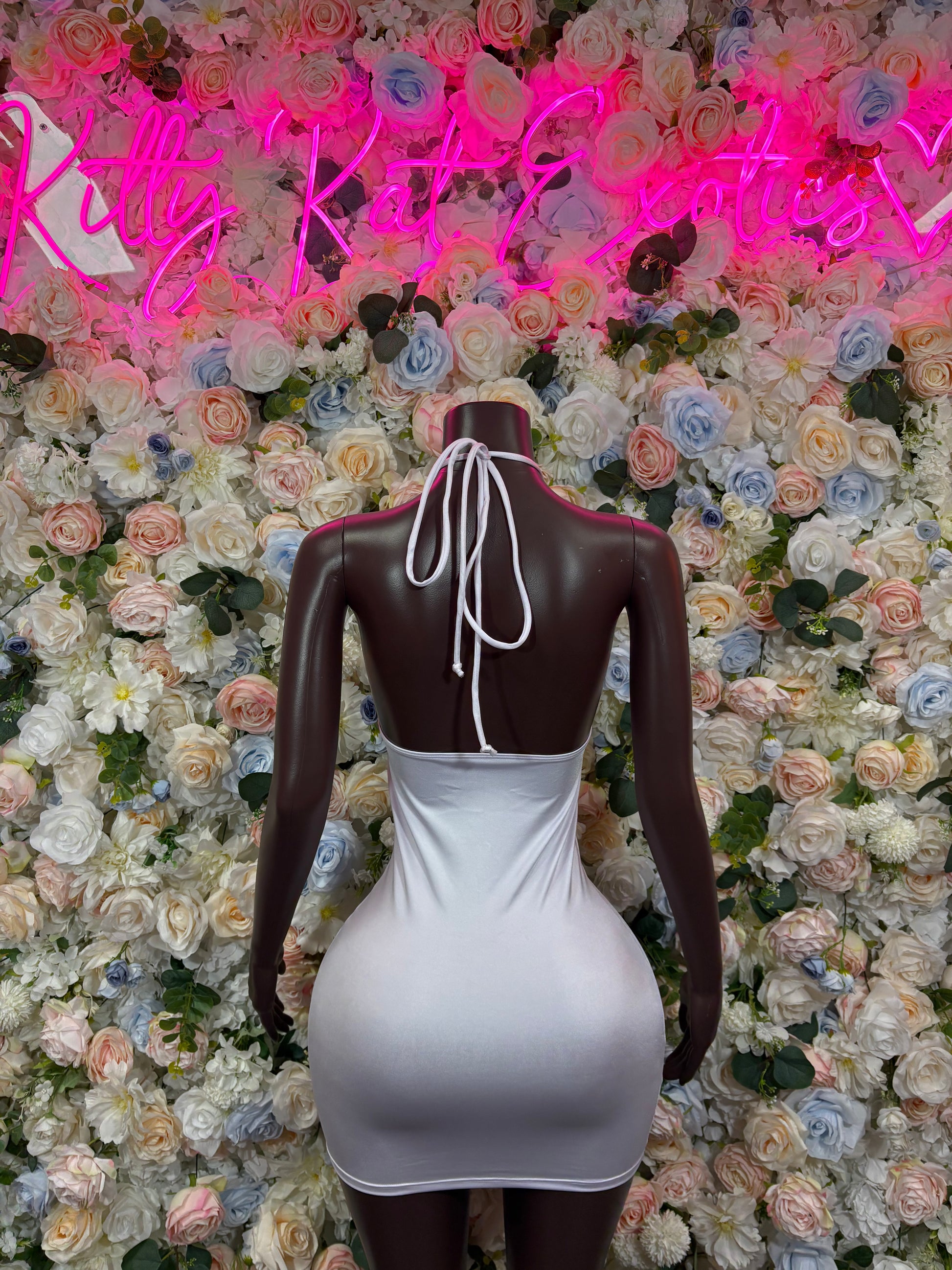 White halter mini dress bodysuit with open-back tie and gold ring detail