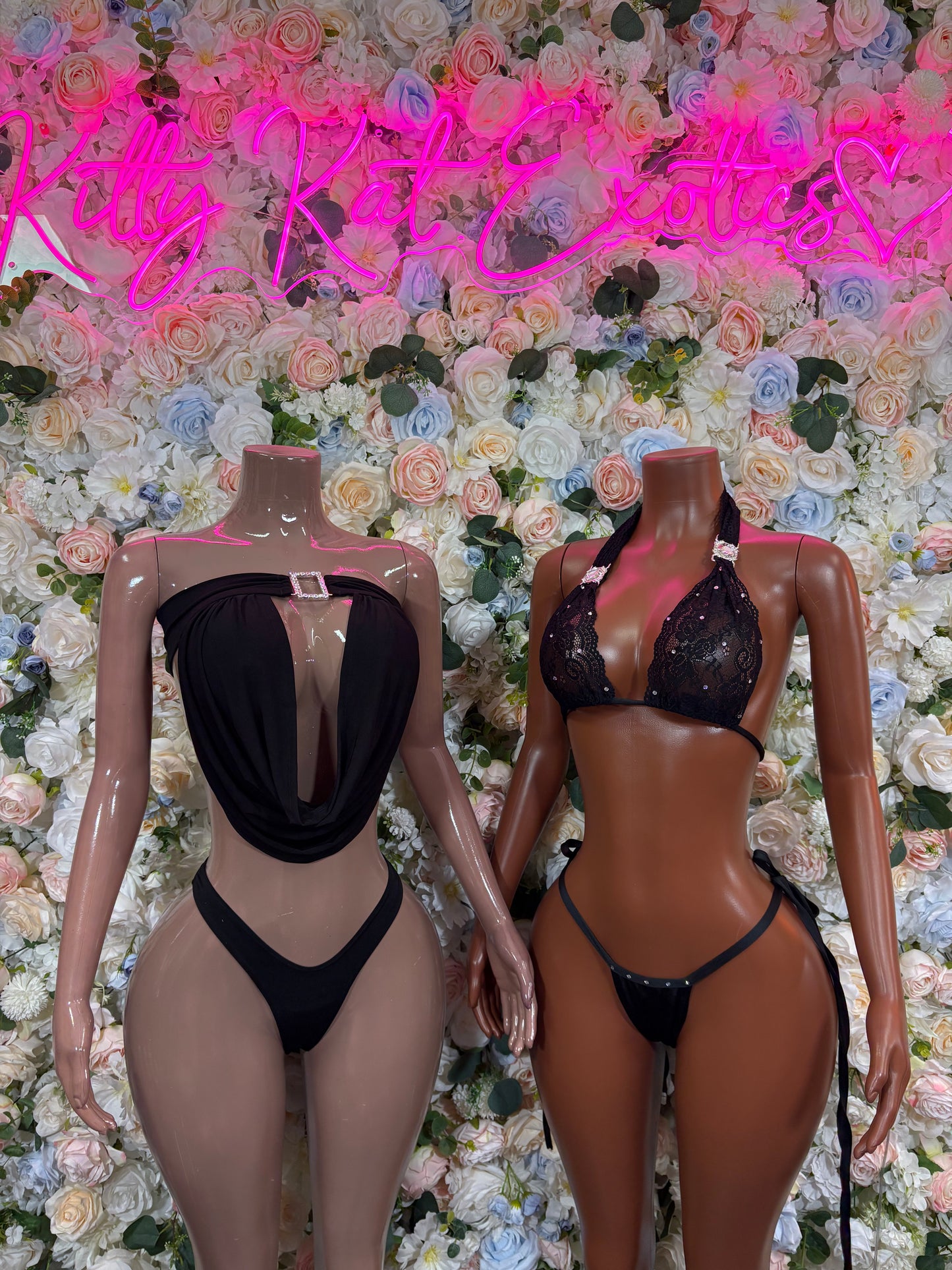 Black two-piece rave set with halter bra and high-cut bottoms on two models