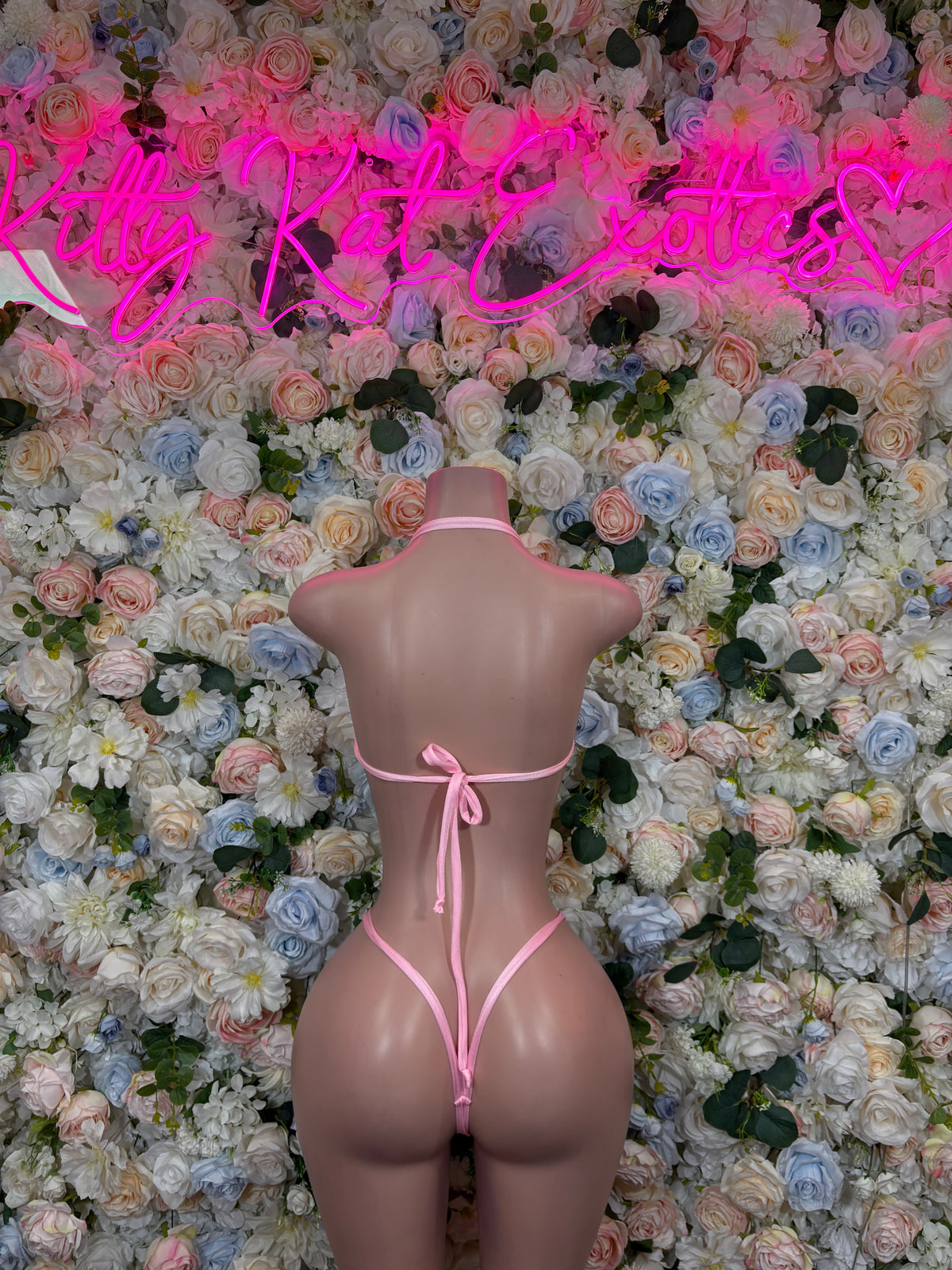 Pink two-piece lingerie set with string back and tie straps