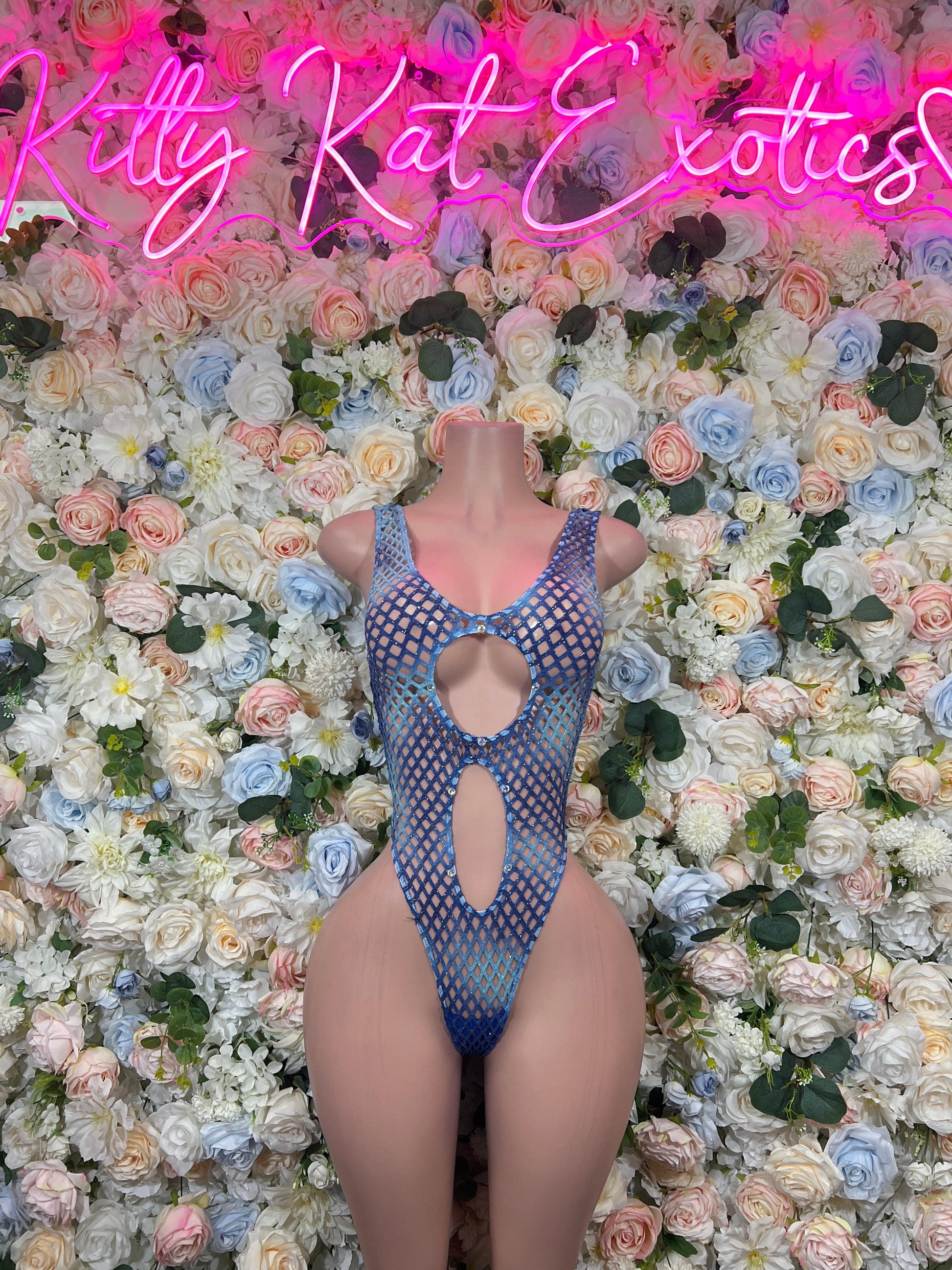Blue fishnet cut-out bodysuit with central oval and vertical keyhole openings