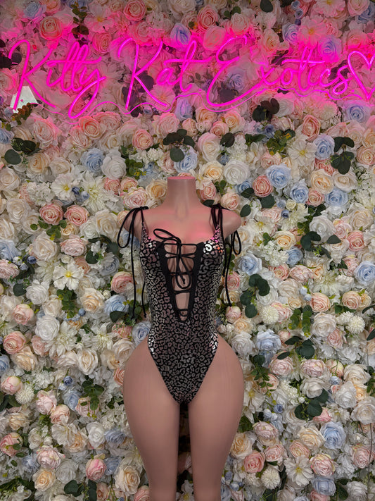 Black cheetah-print bodysuit with long sheer sleeves and center back lace-up panel