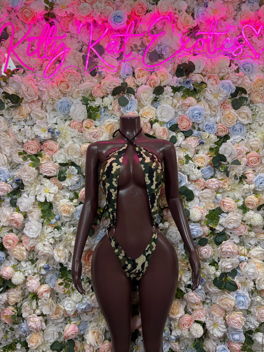Camo print halter thong bodysuit on dark mannequin, open back and high-cut legs