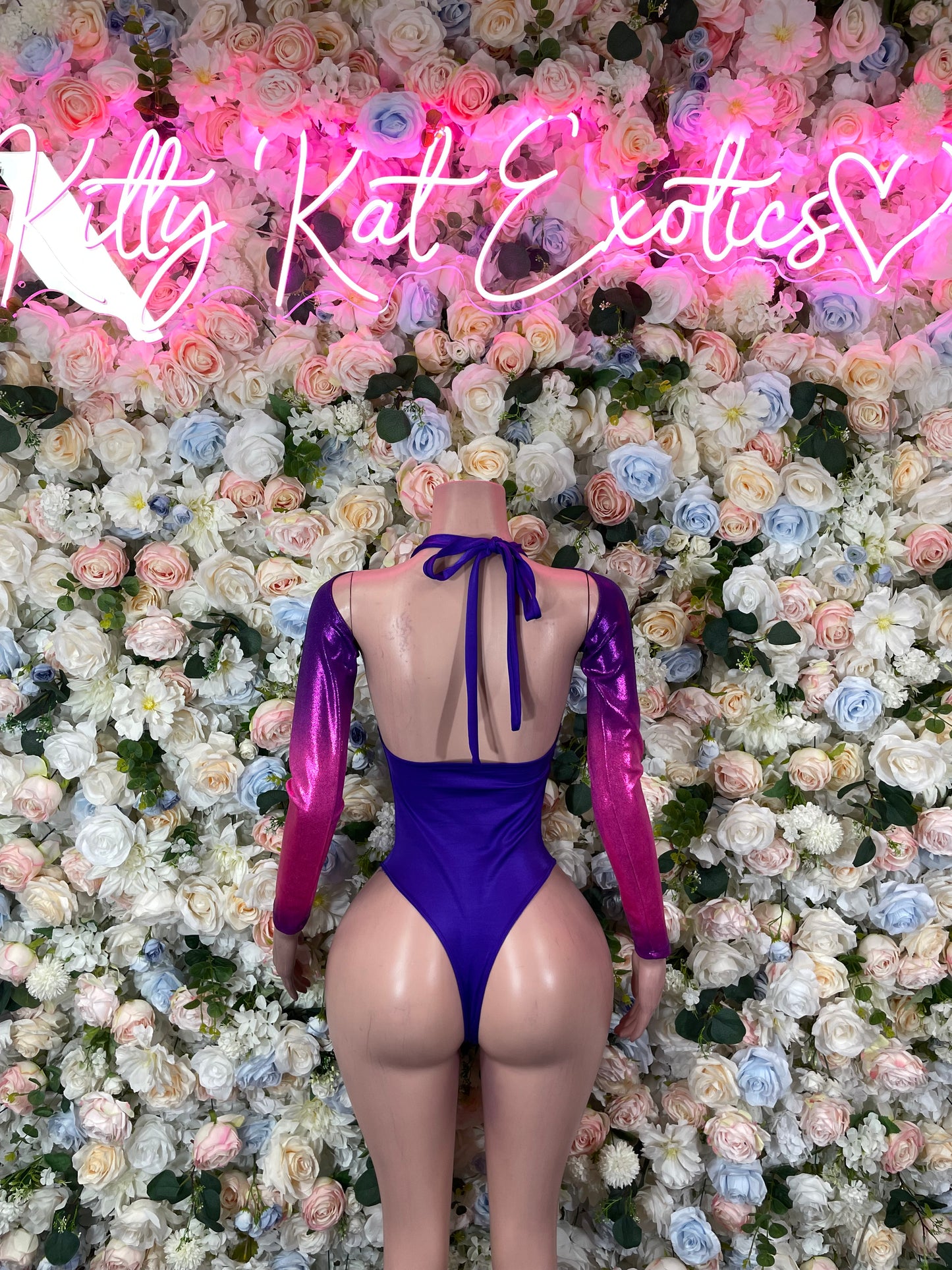 Purple long-sleeve bodysuit back with open V panel and tied neck ribbon