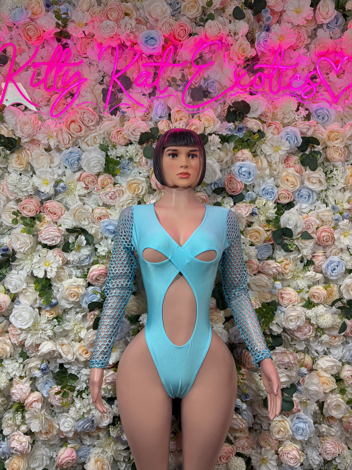 Teal bodysuit with oval chest cutouts and mesh long sleeves