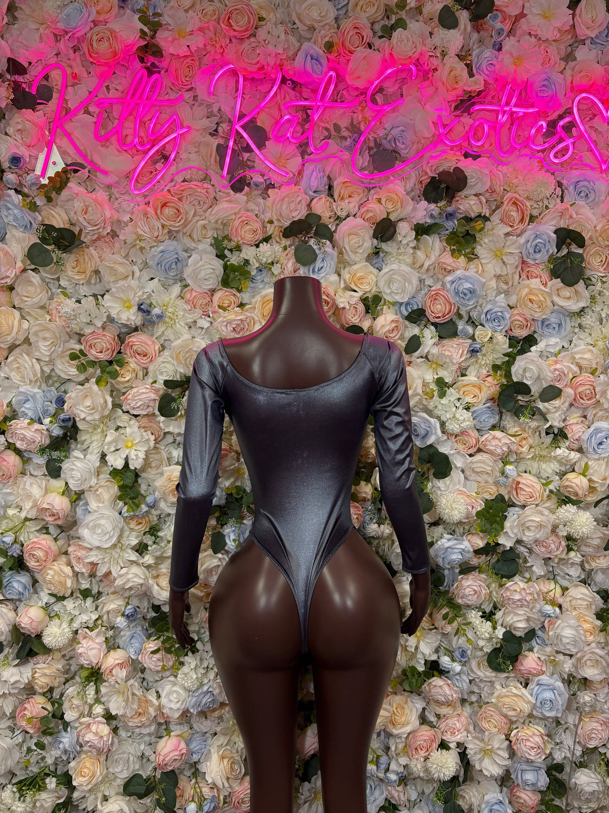 Dark gray metallic long-sleeve one-piece with scoop neckline and high leg