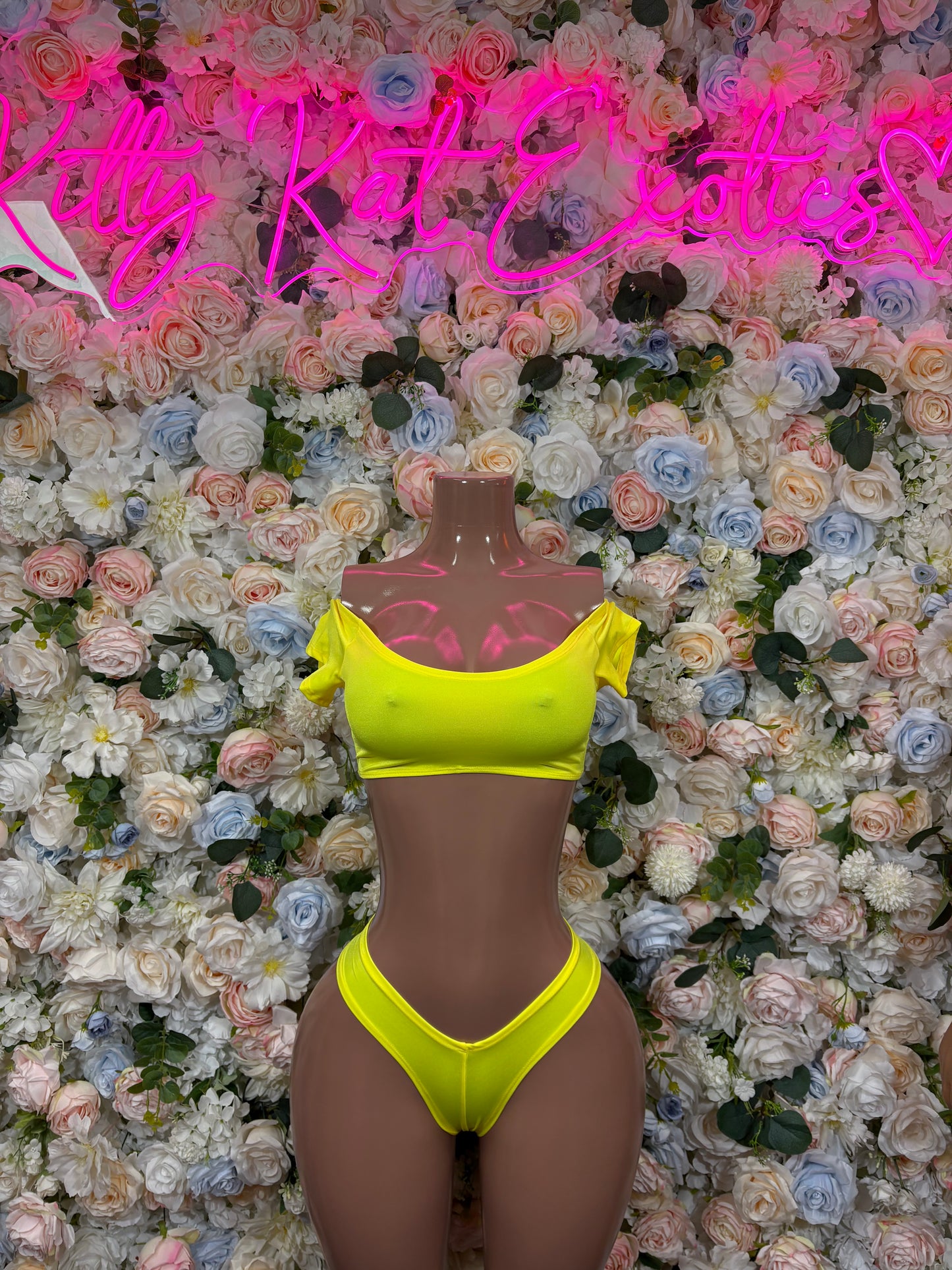 Women's yellow bikini set with triangle halter top and high-cut bottoms