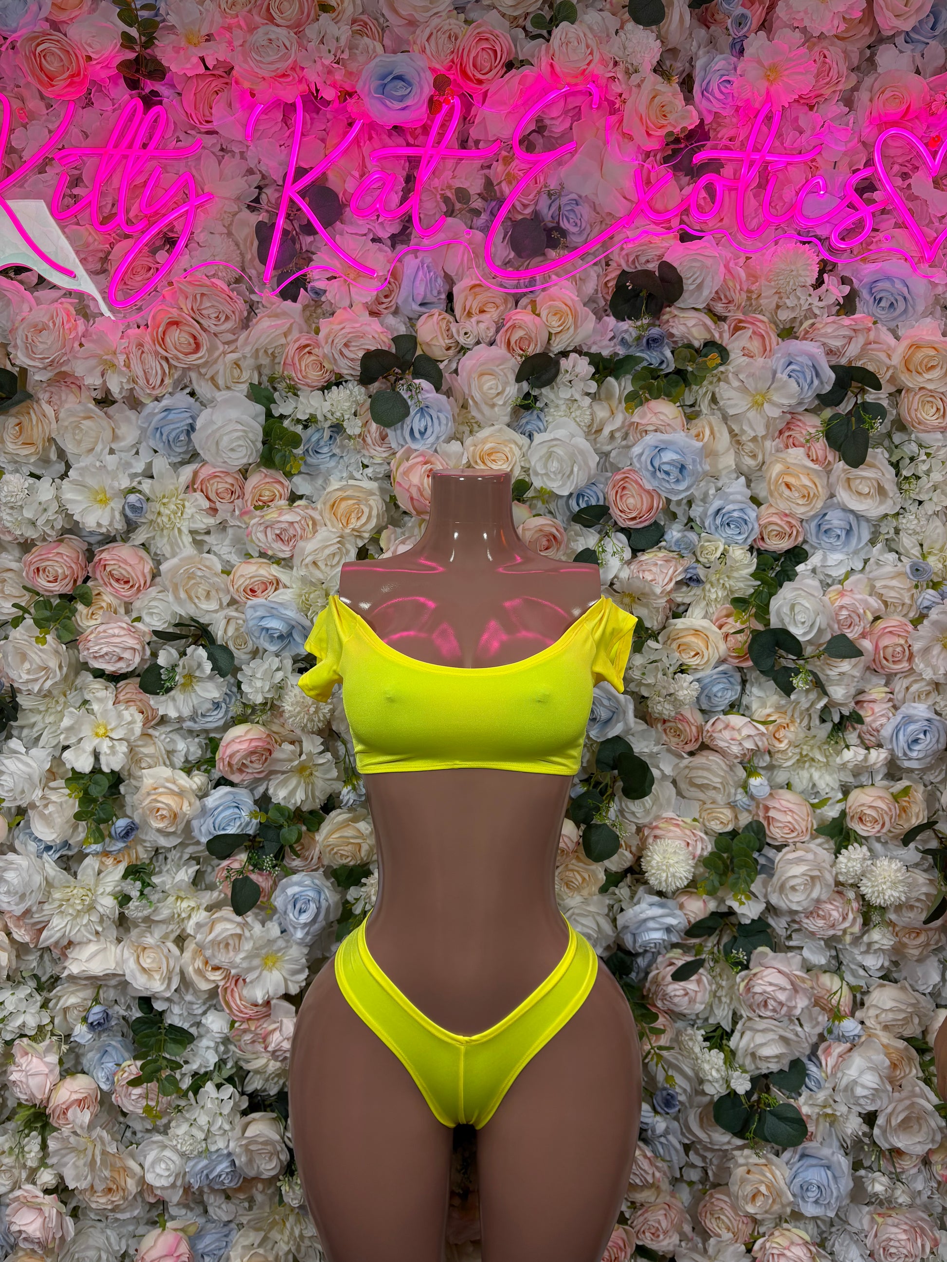 Women's yellow bikini set with triangle halter top and high-cut bottoms