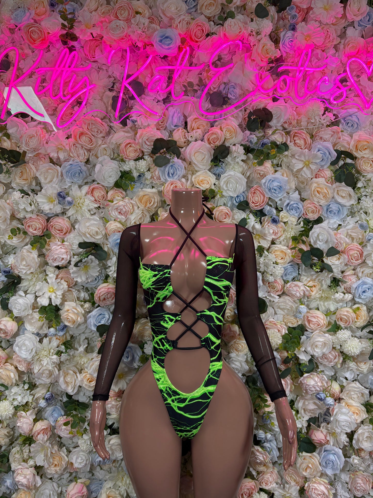Black mesh one-piece bodysuit with neon green and yellow lightning print, lace-up front