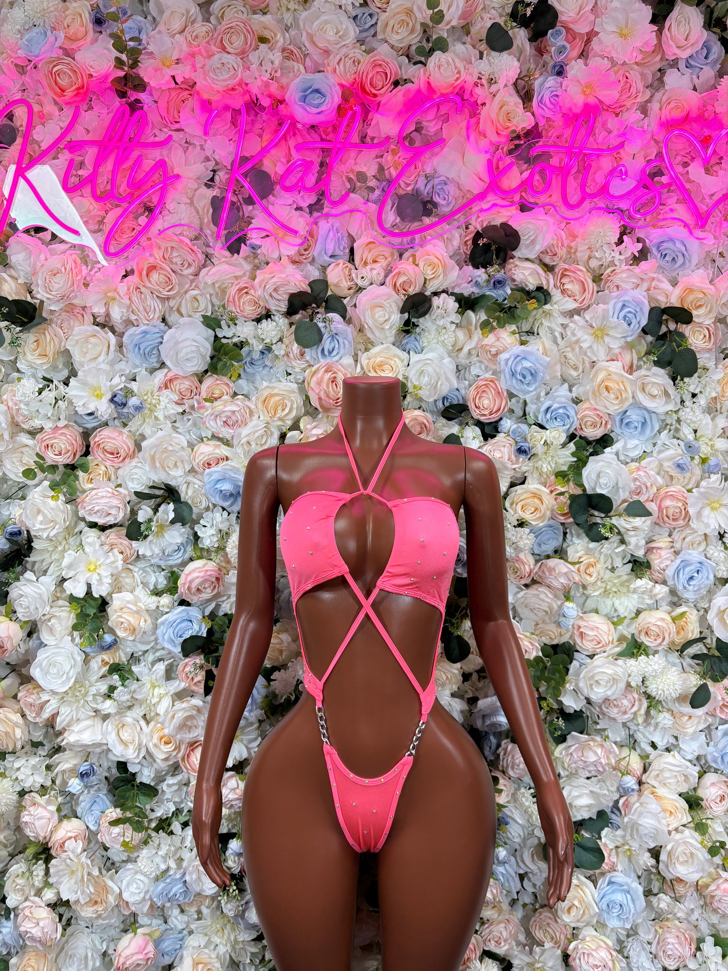 Coral rhinestone bodysuit with halter neckline and crisscross back straps