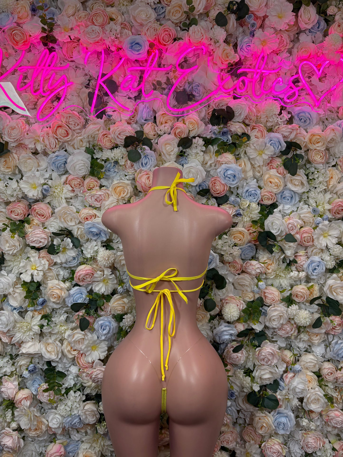 Yellow lingerie set with halter back straps and tied string thong bottoms