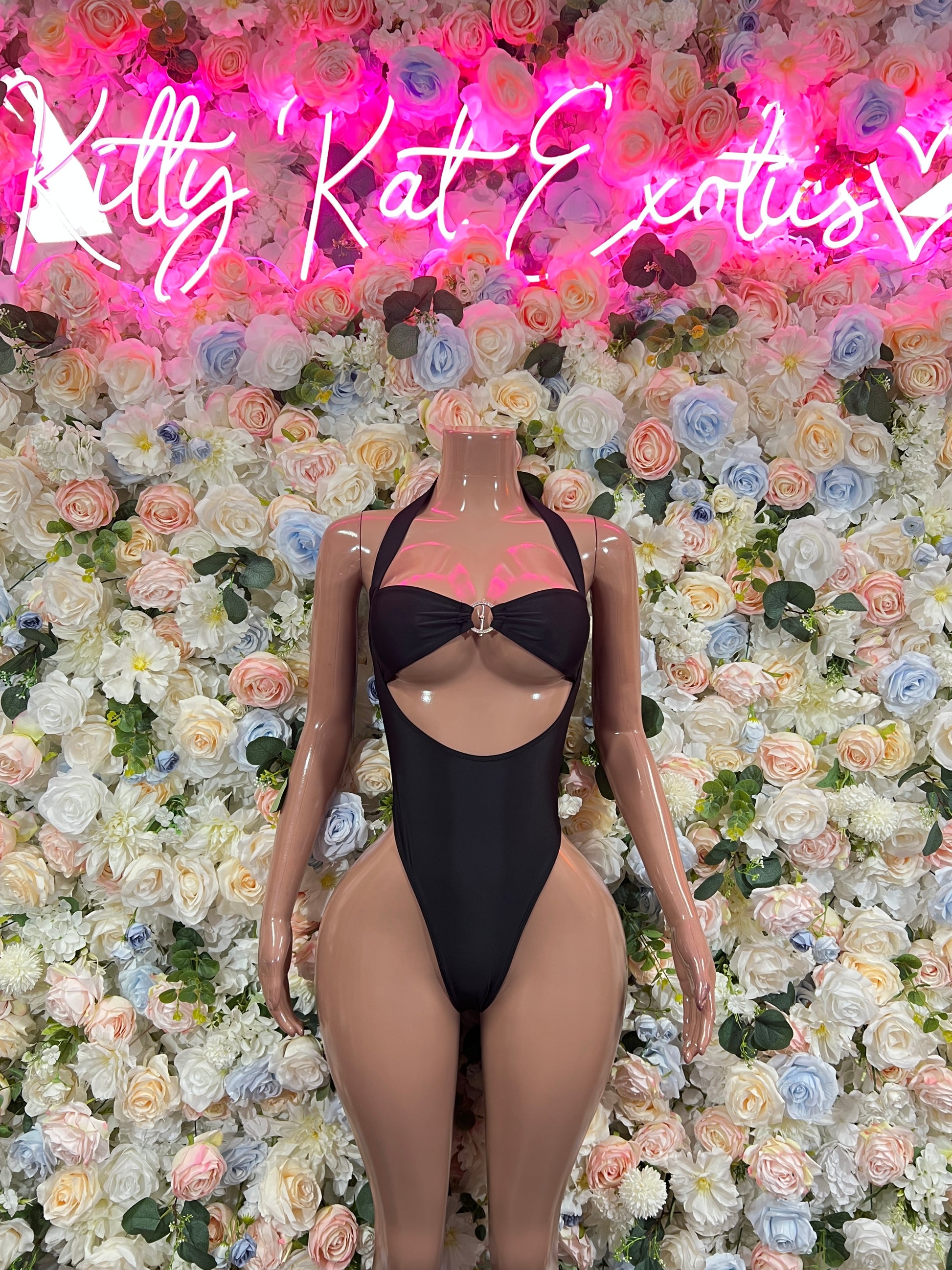 Black halter one-piece bodysuit with high-cut legs and chest cutout