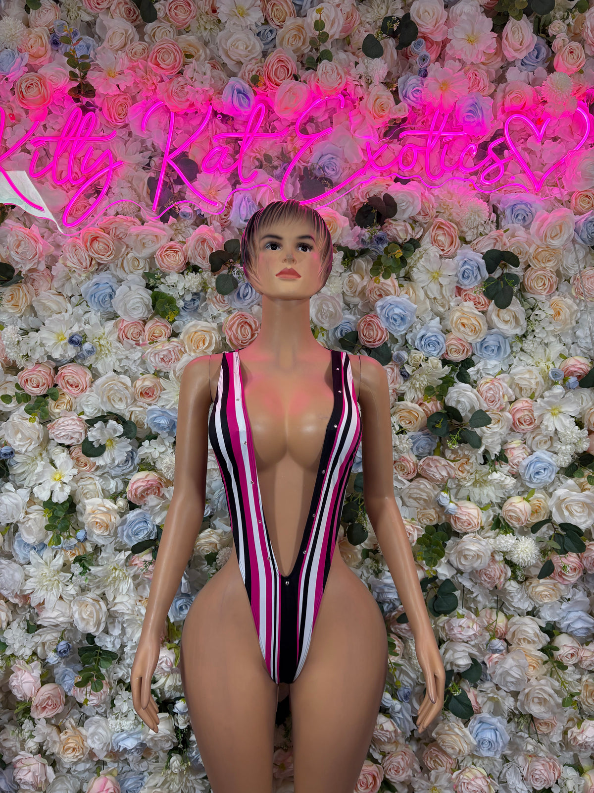 Striped plunge one-piece bodysuit, pink, black, and white with deep V neckline
