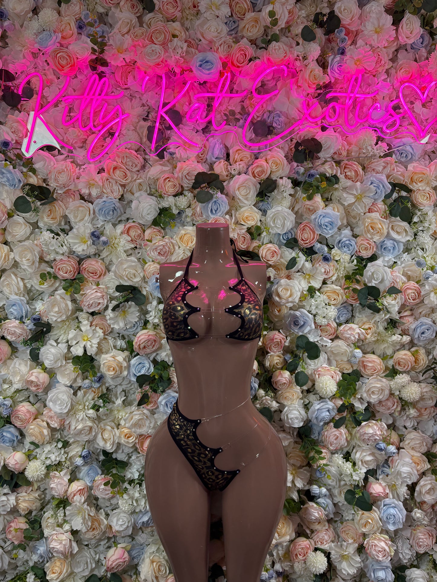 Black lace two-piece bodysuit with cheetah-print bra and thong cutouts
