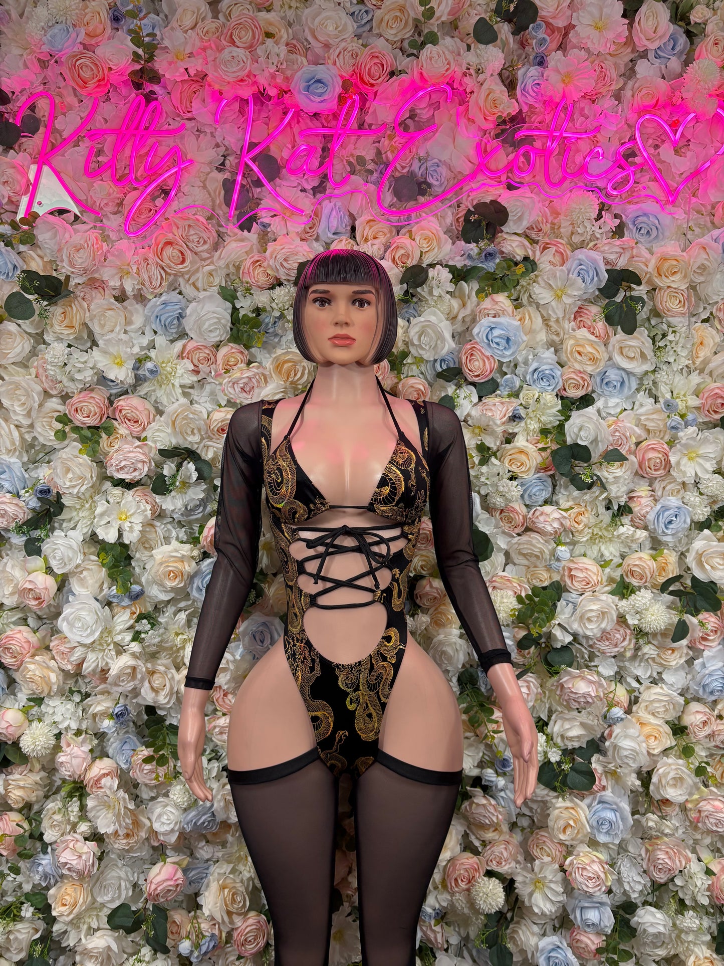 Black dragon-print bodysuit with lace-up front, long sleeves and sheer panels