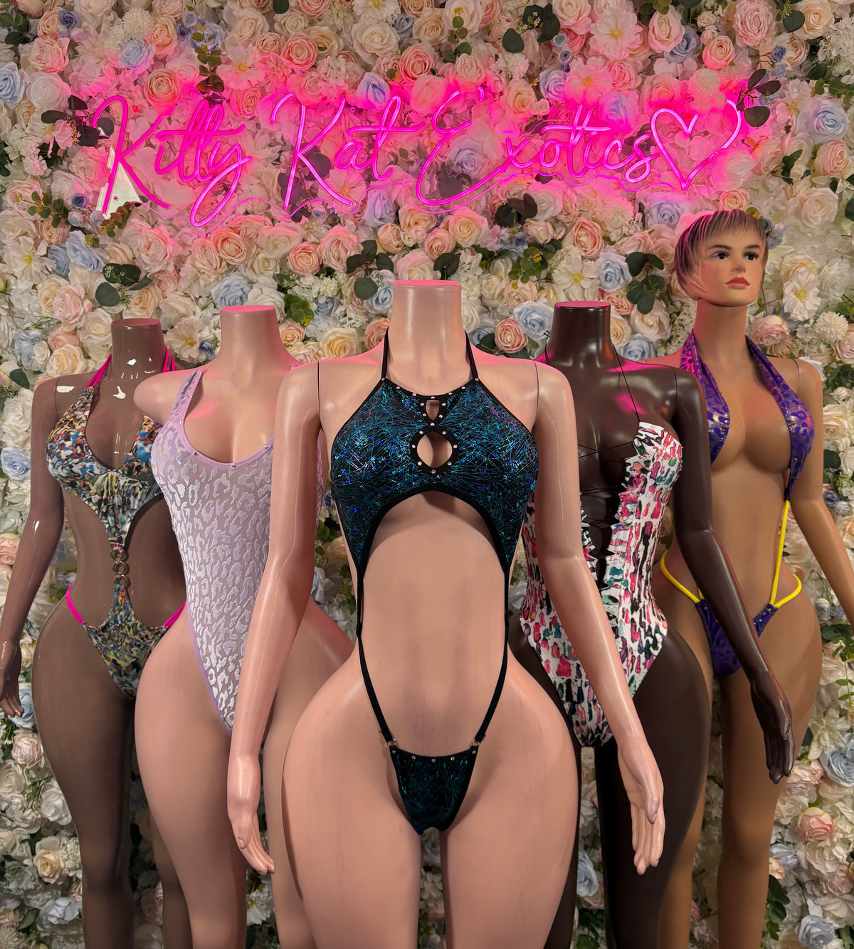 Leopard-print high-cut bodysuits on mannequins, sleeveless
