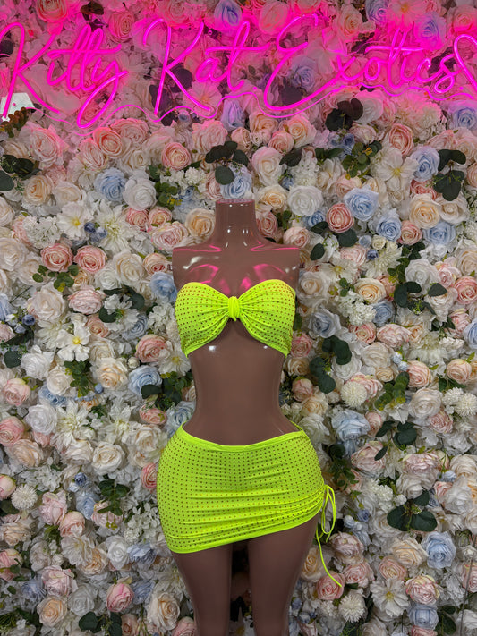Neon green rhinestone bandeau top and mini skirt on mannequin