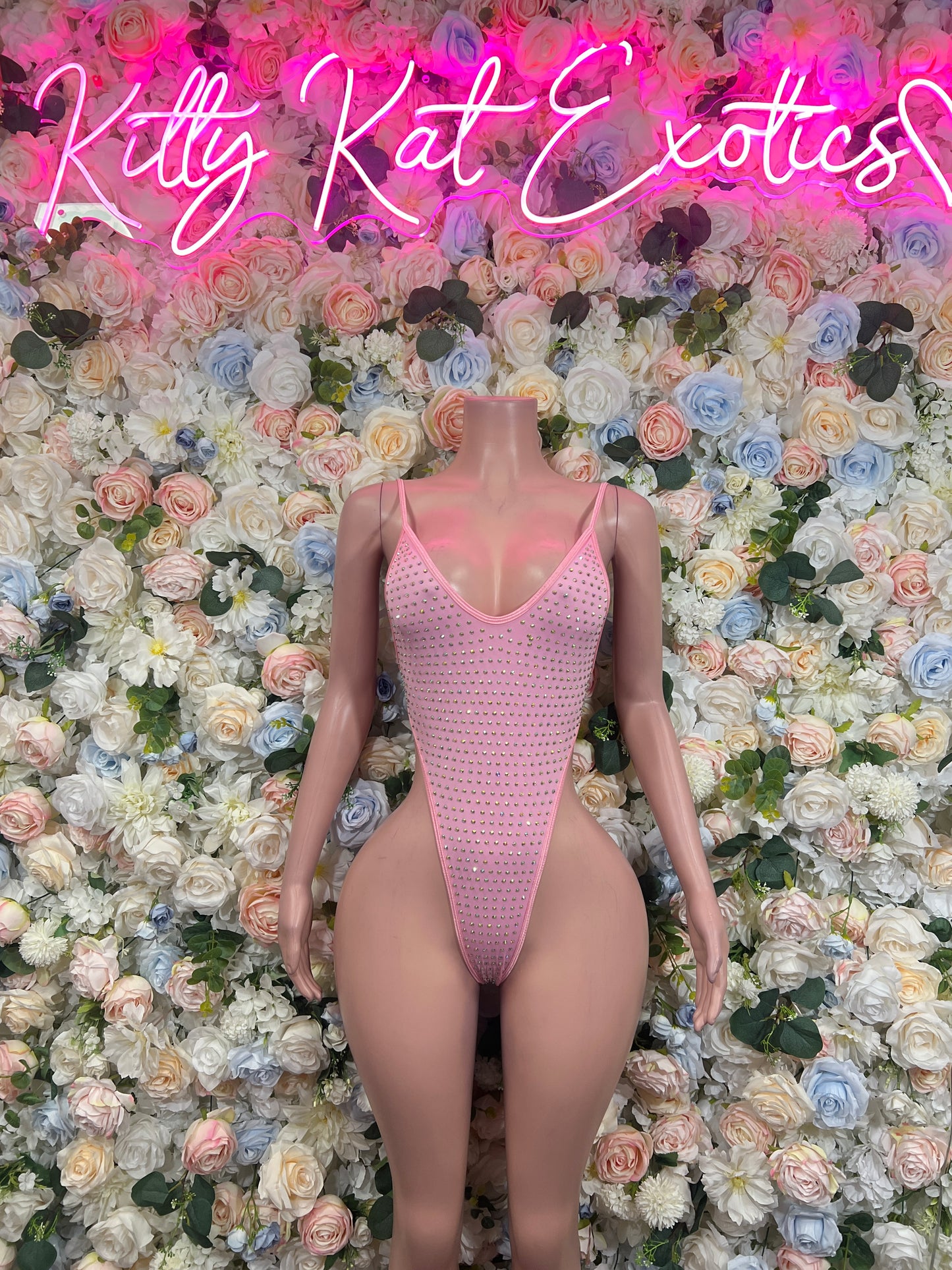 Pink rhinestone one-piece bodysuit with thong back and wide V-neck