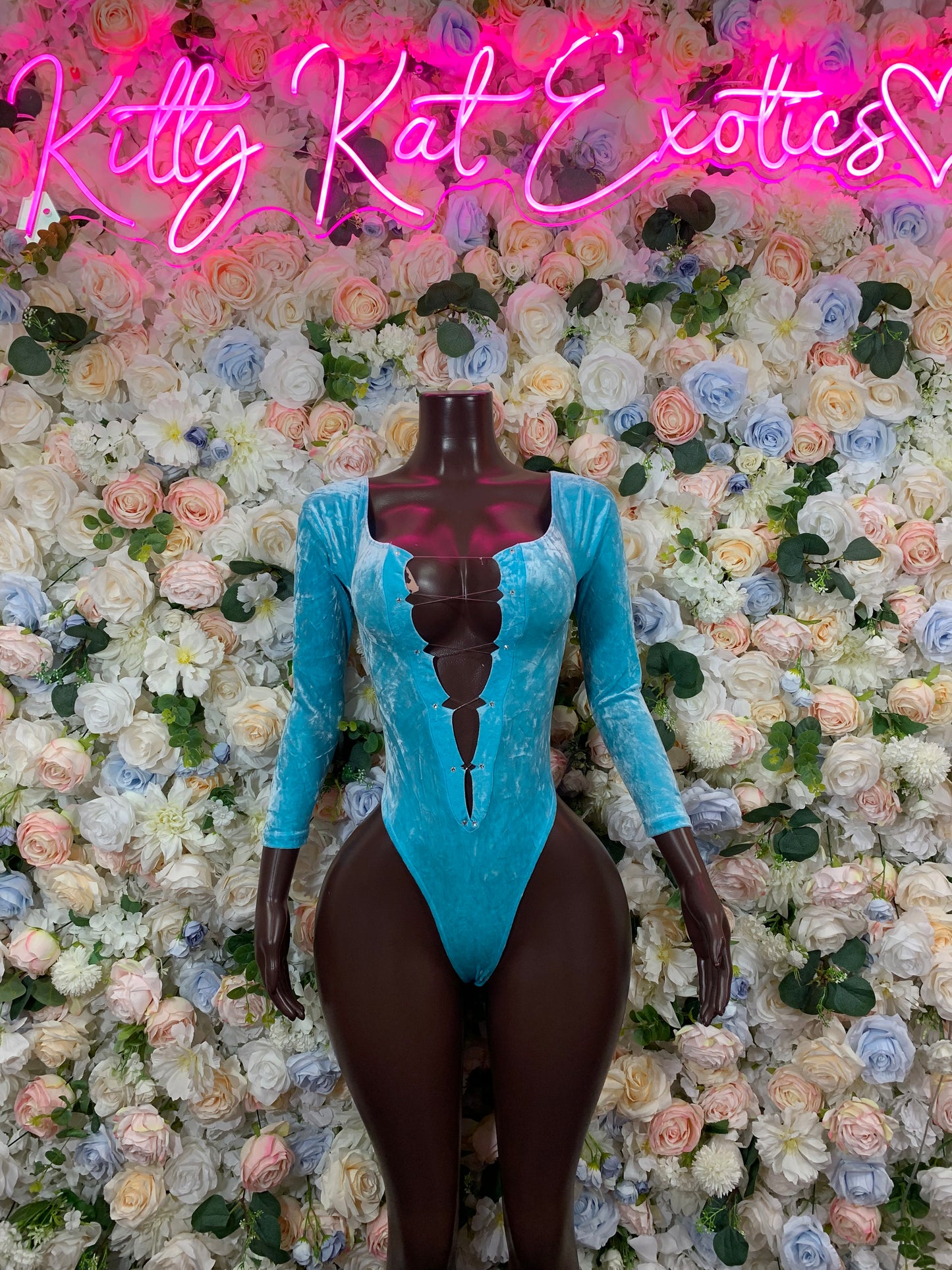 Turquoise long-sleeve one-piece rave bodysuit with high-leg cut and deep V front