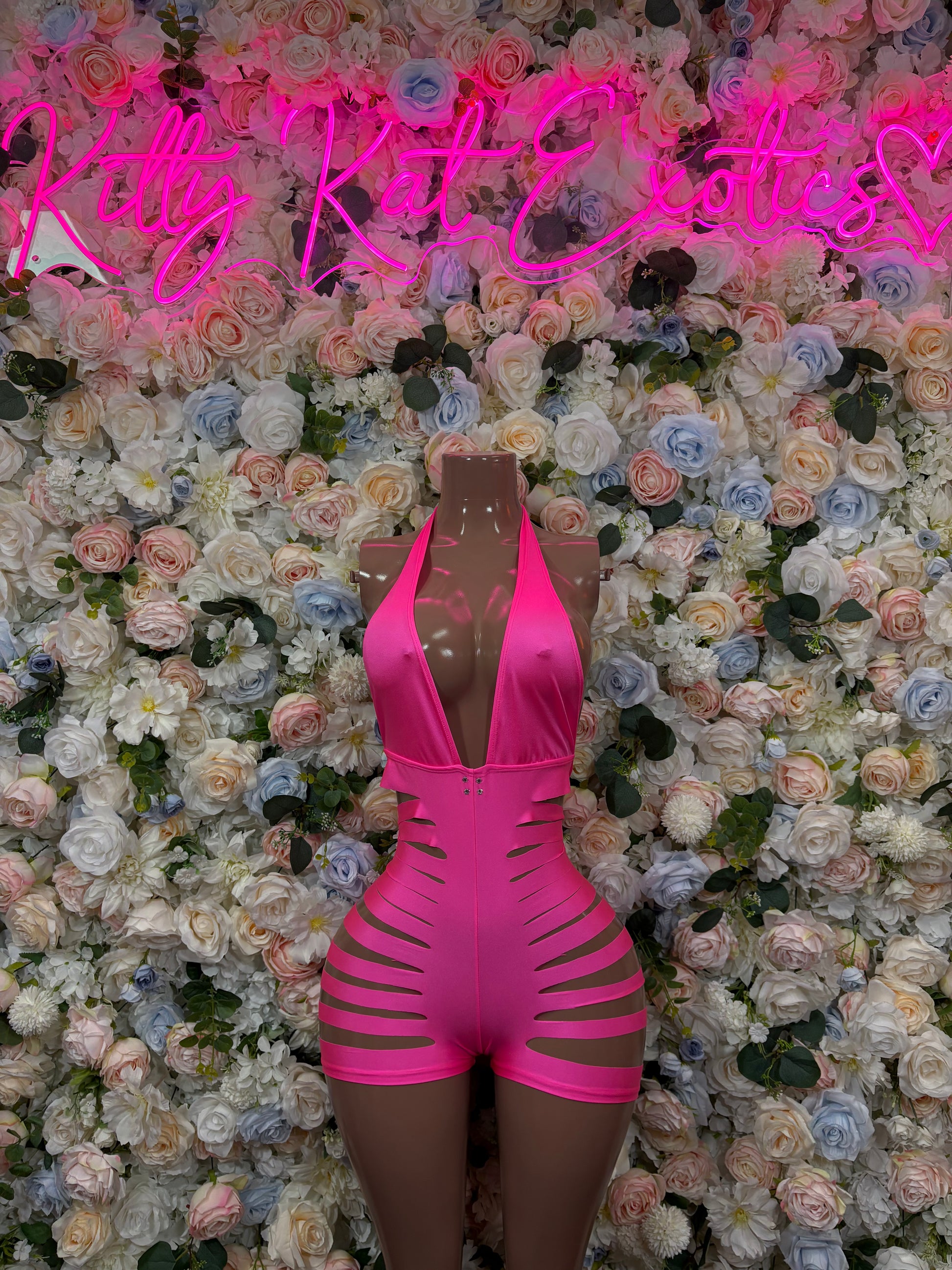 Hot pink cutout rave bodysuit with lace-up side straps