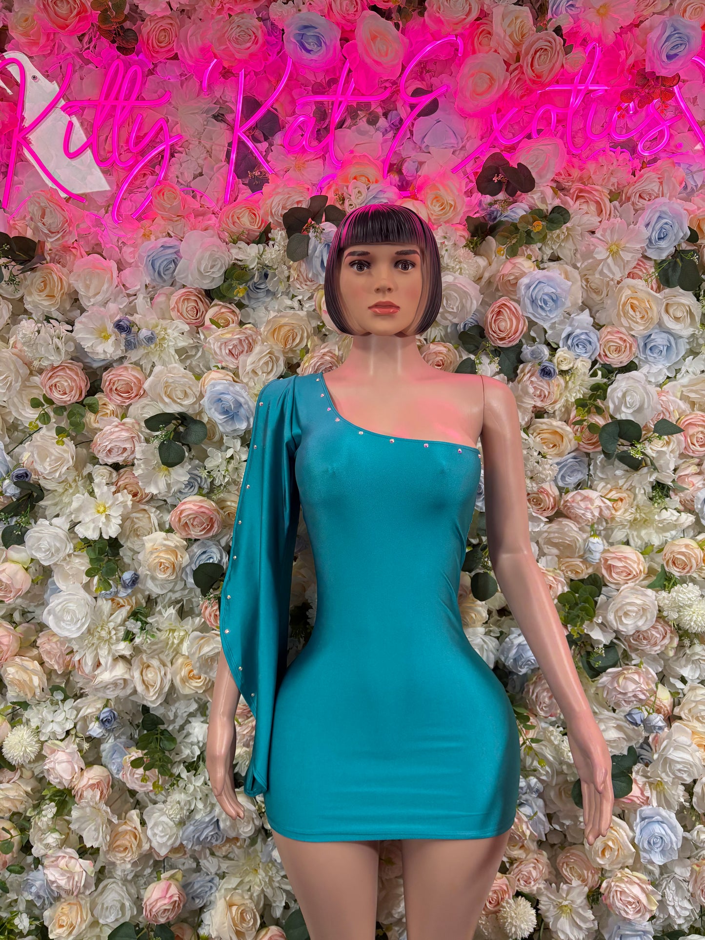 Turquoise one-piece dress with long sleeves and sweetheart neckline, fitted bodycon