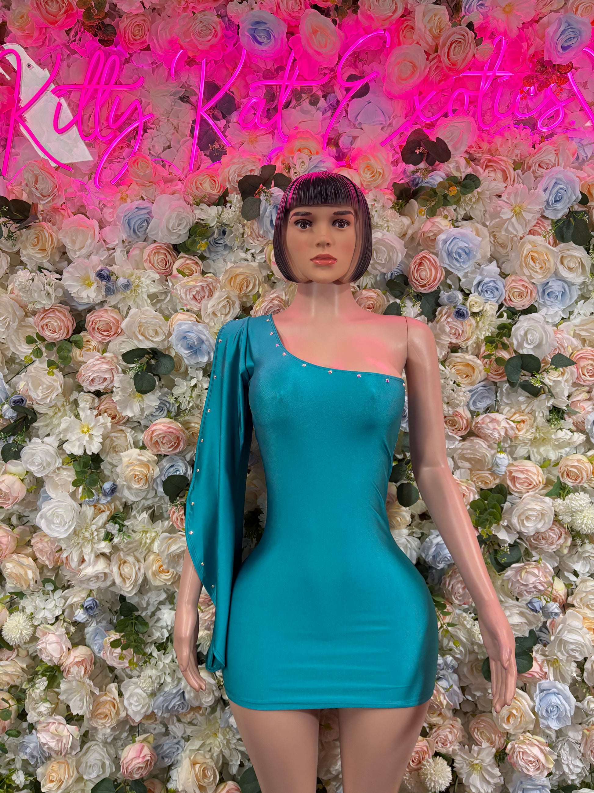 Turquoise one-piece dress with long sleeves and sweetheart neckline, fitted bodycon