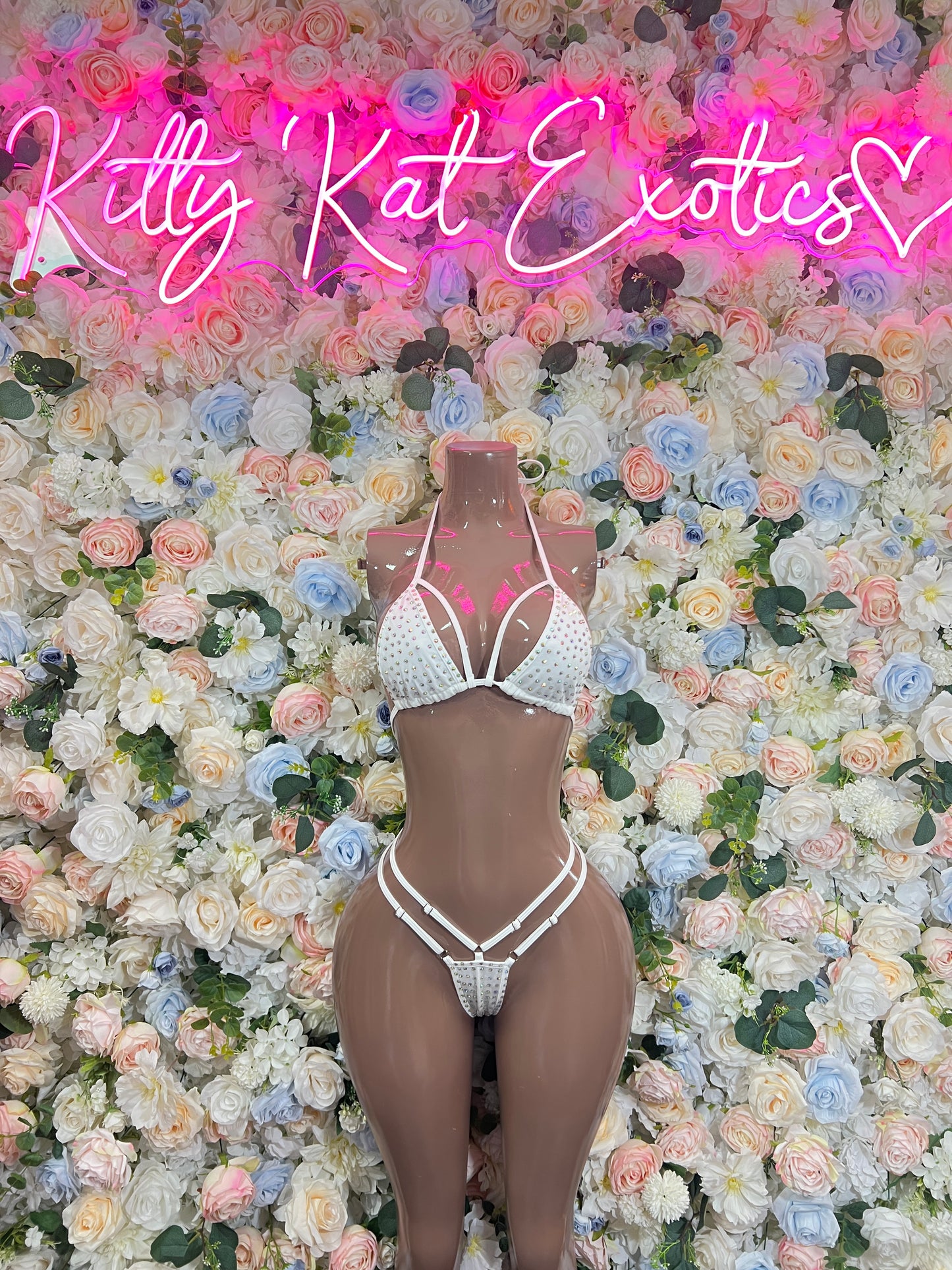 White rhinestone bikini set on mannequin, triangle top and high-cut tie-bottoms