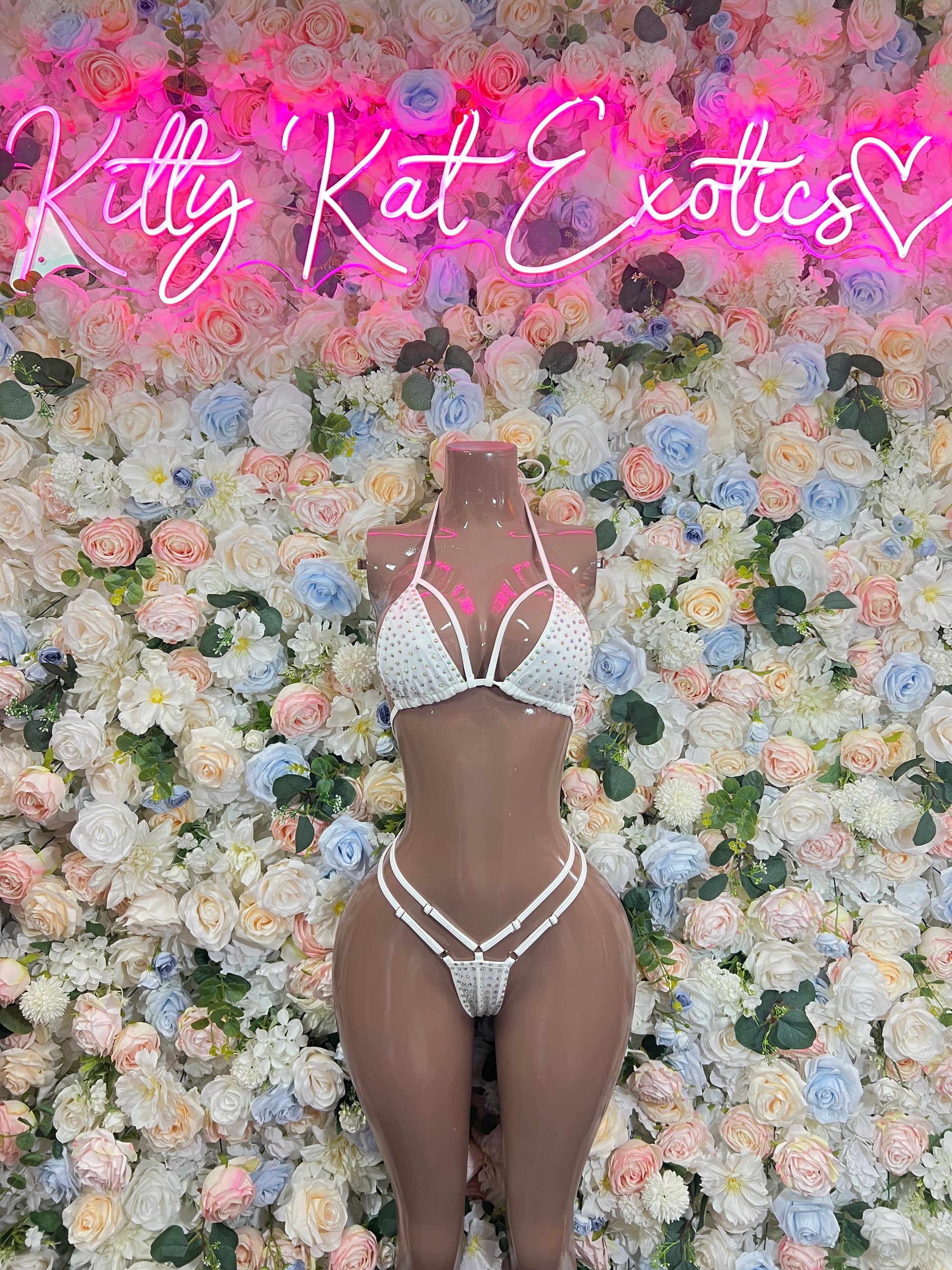 White rhinestone bikini set on mannequin, triangle top and high-cut tie-bottoms